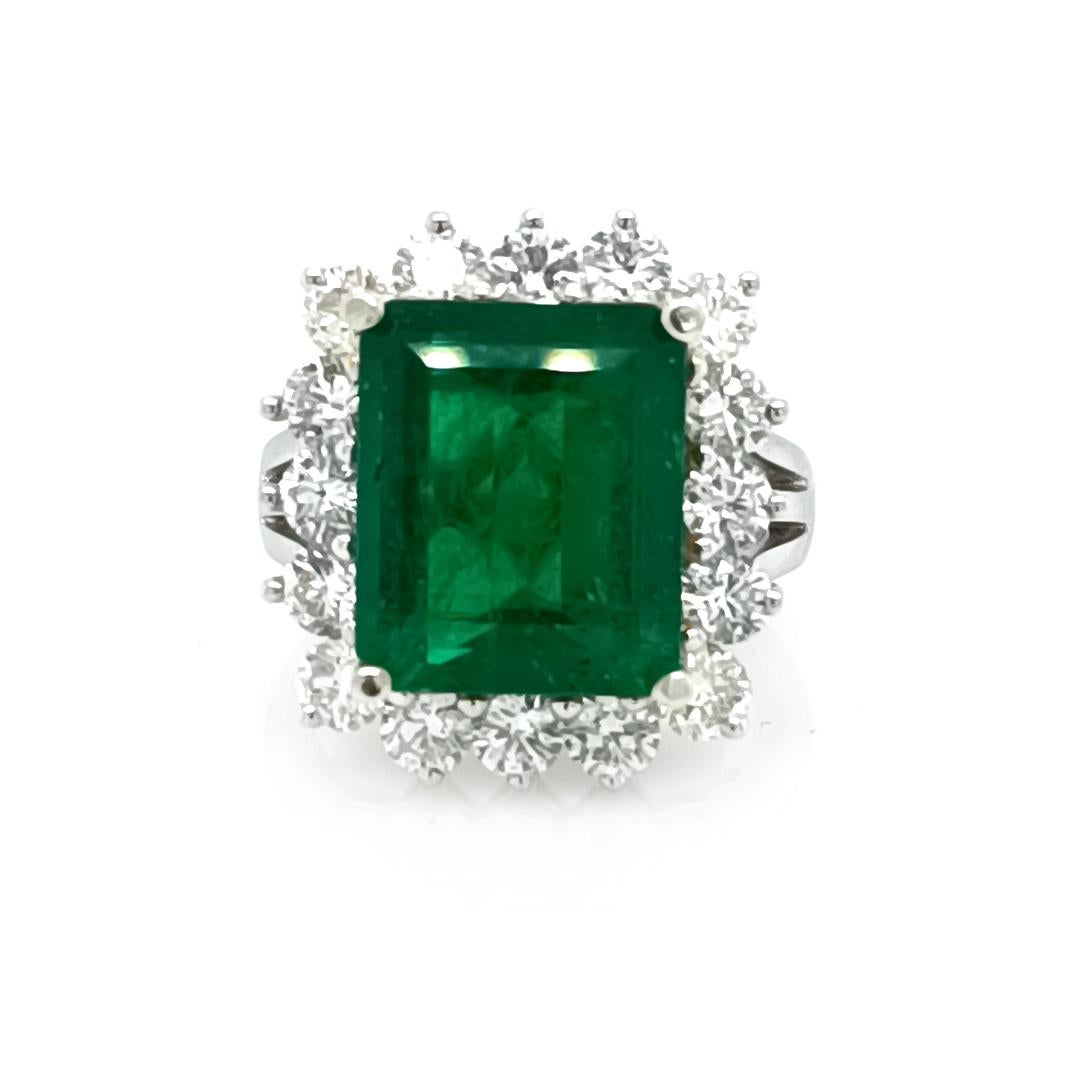 7.01 Ct Emerald surrounded by diamonds 2.72 Cts

Set in 18K gold 2-Tone, 9.16 Grams

*Emerald Cut Emerald / Round Brilliant Cut Diamonds