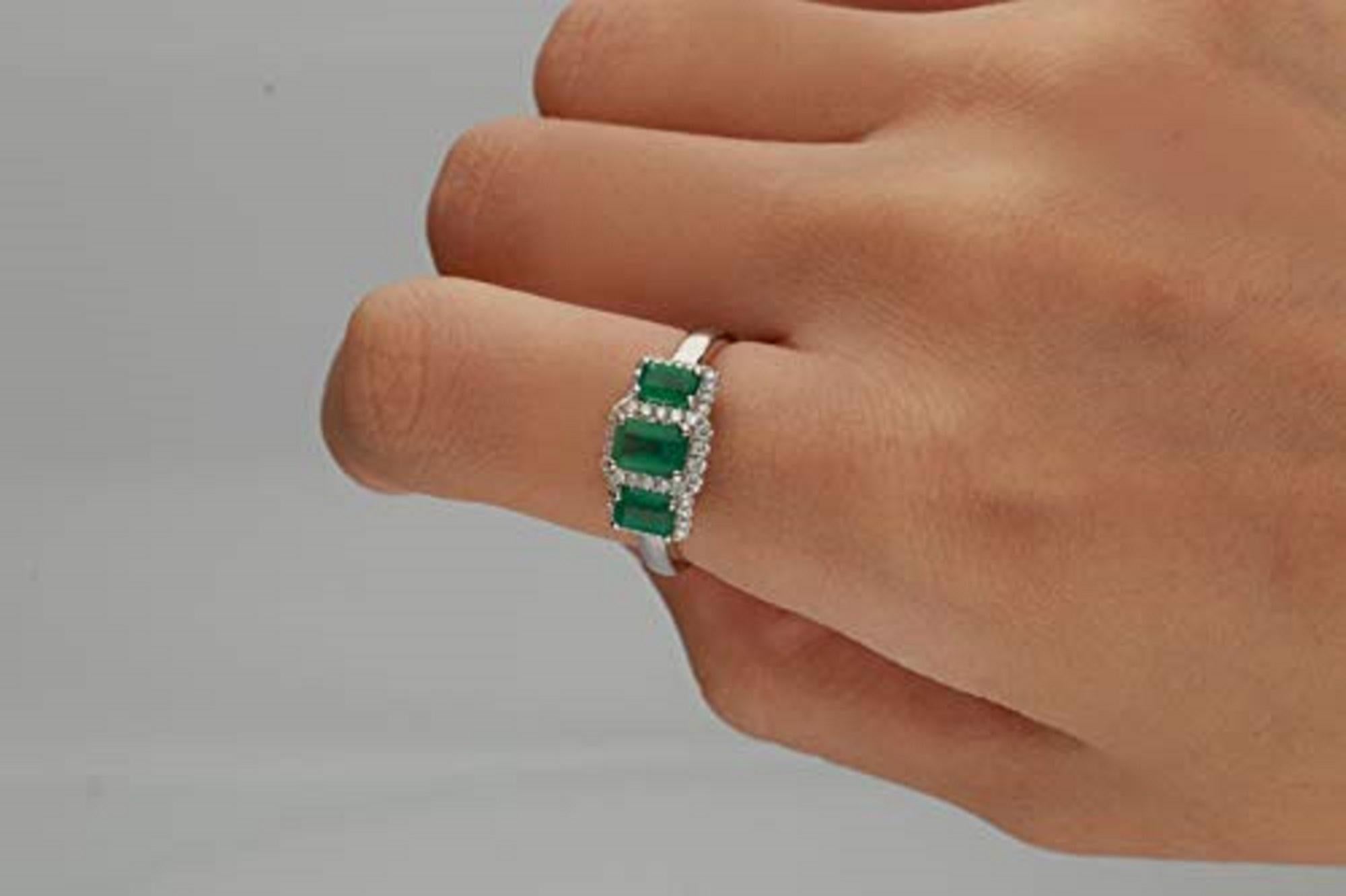 Stunning, timeless and classy eternity Unique Ring. Decorate yourself in luxury with this Gin & Grace Ring. The 10K White Gold jewelry boasts with Emerald-Cut Emerald (3 pcs) 1.21 carat and Natural Round-cut white Diamond (44 Pcs) 0.19 Carat accent