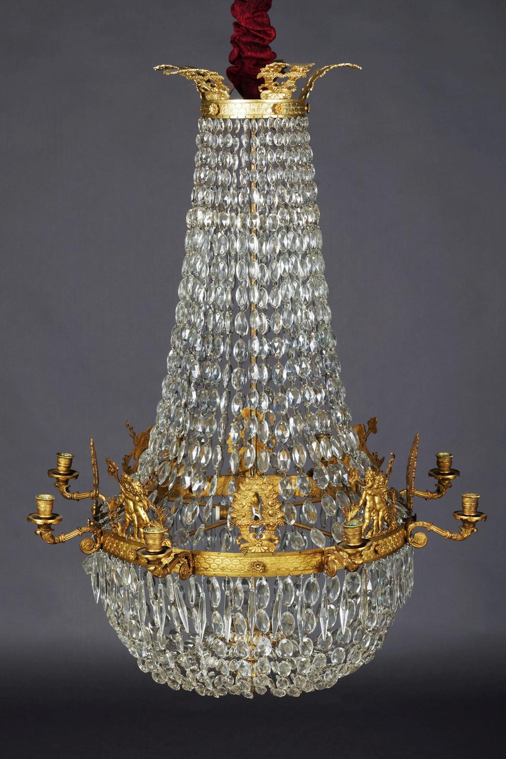 Classic Empire chandelier, dreamlike and noble

Noble Empire Chandelier first half of the 19th century
Finely chased bronze and gilding. Basket-shaped body made of hand-wired pearl cords. In the course with leaf rosette and concluding pine knob.