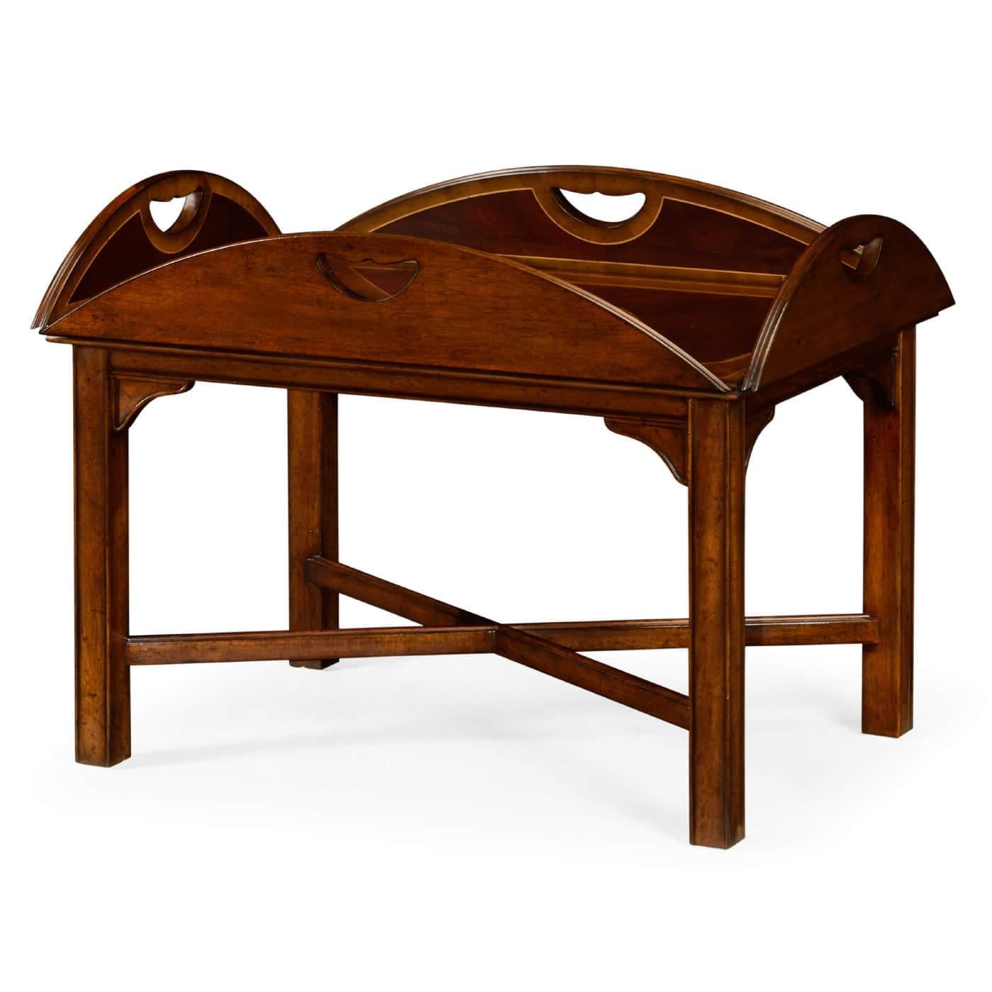 Classic English mahogany butler's tray table with countersunk hinges that allow the sides to fold upwards and the tray to be carried. 

Dimensions: 40