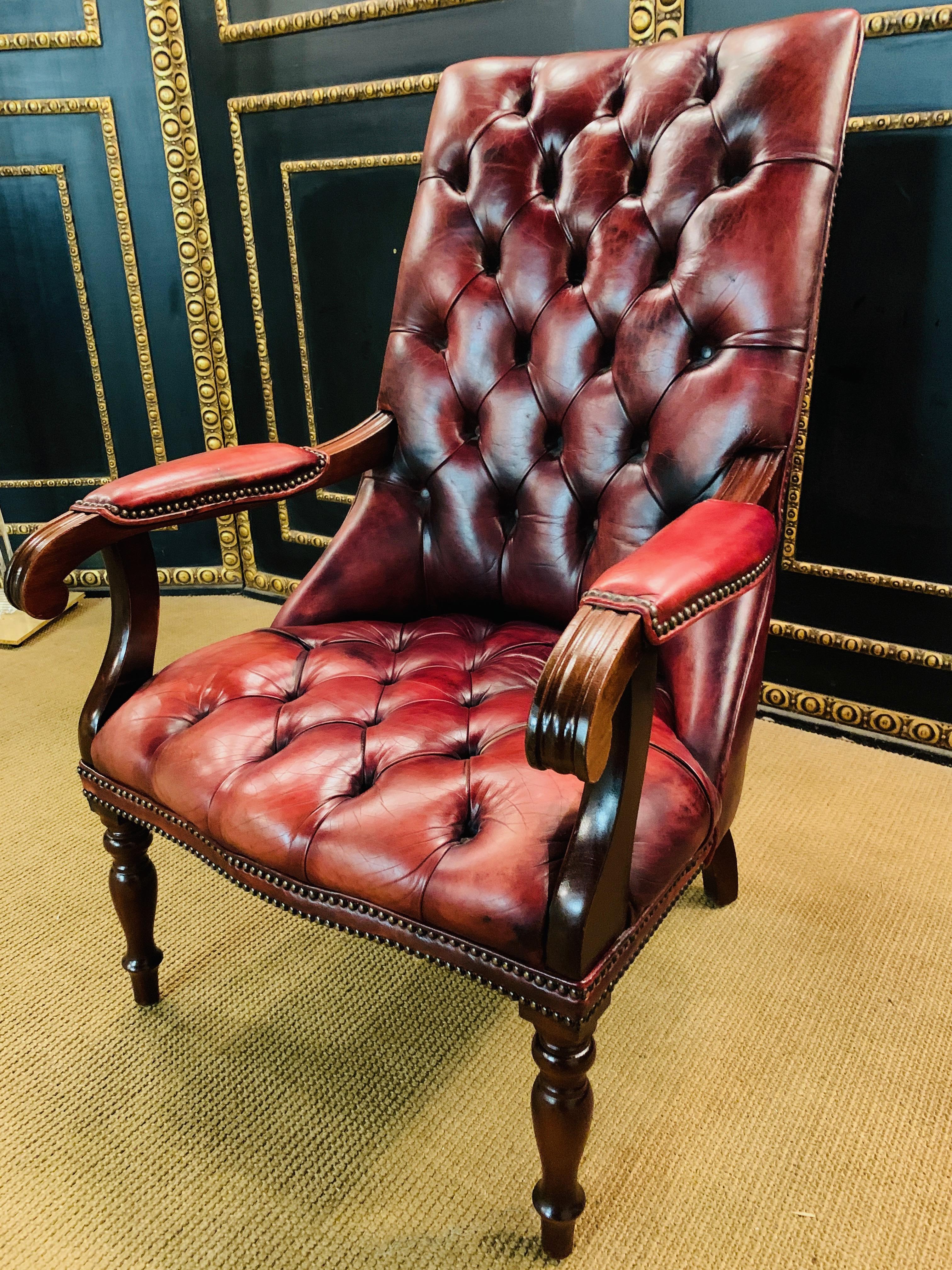 handsome looking oxblood leather wingback armchair