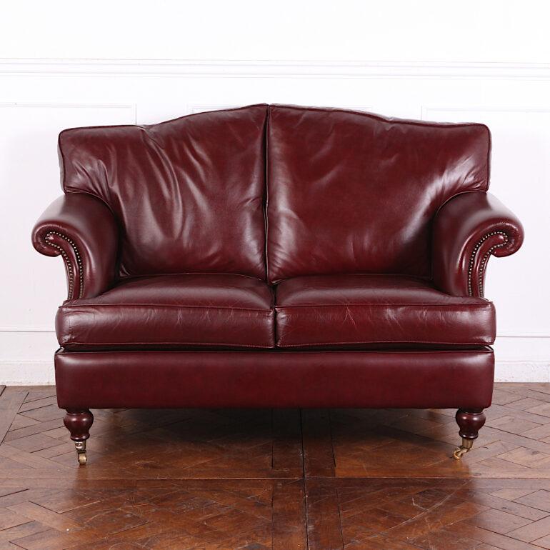 Classic English Rolled Arm Oxblood Leather Two Seat Sofa In Good Condition In Vancouver, British Columbia