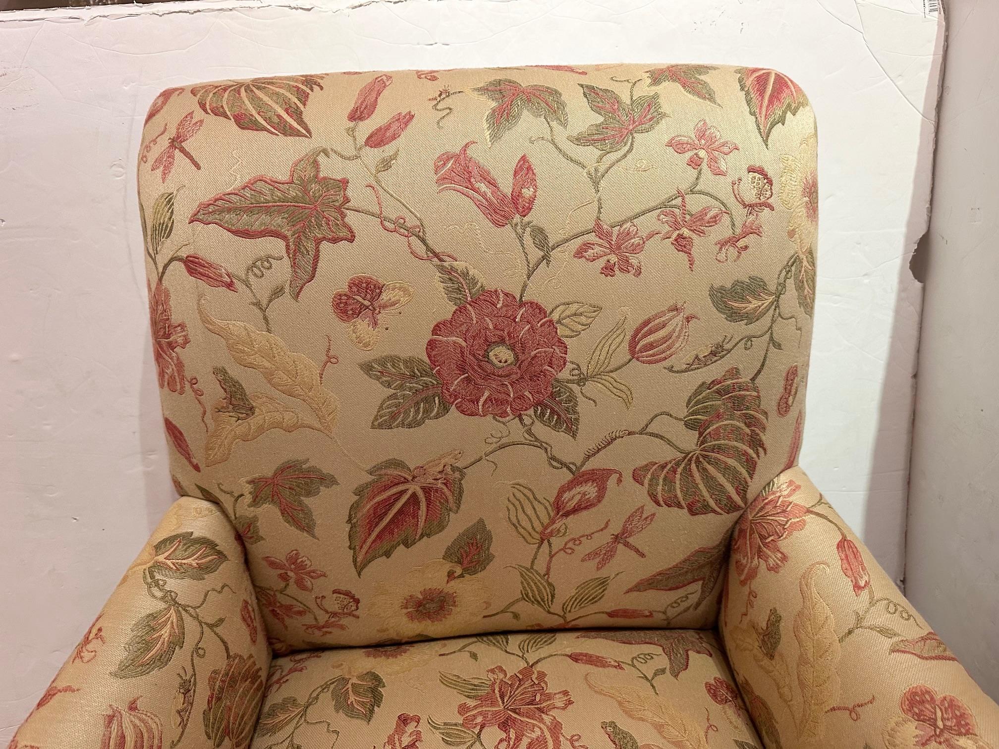 Pretty English style upholstered arm club chair having muted woven floral fabric in sage green and terracotta.  Arm height 22.5  seat depth 20
Legs are walnut and handsomely turned.

Gayle