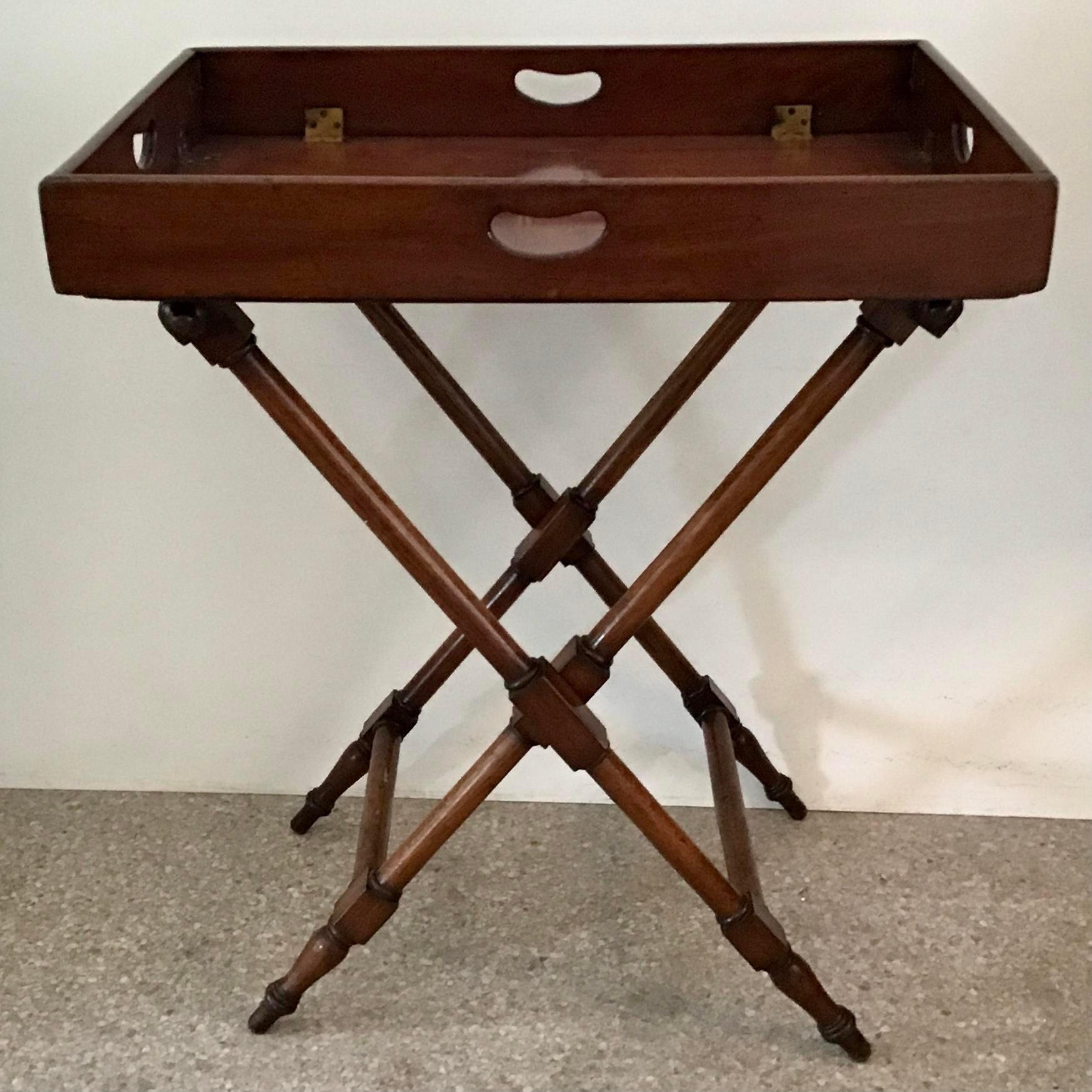 Beautiful English and elegant design wood serving tray table. Folding base for easy storage. Would be a great addition to your bar or studio.