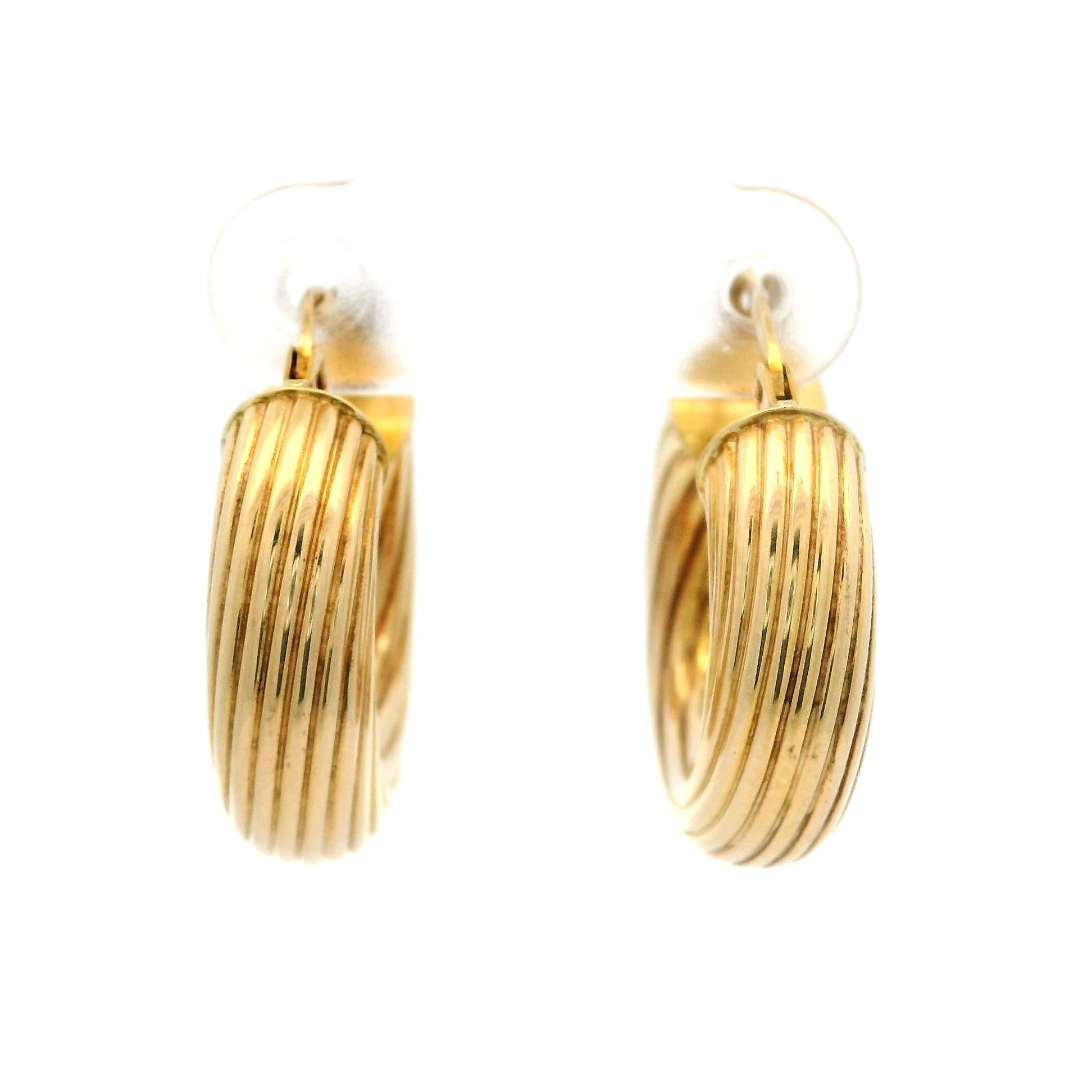 Material: Solid 14K Yellow Gold - Hollow design
Weight: 3.7 Grams
Backing: Posts w/ Snap closure (Pierced ears required)
Overall Width: 20.8mm (0.81