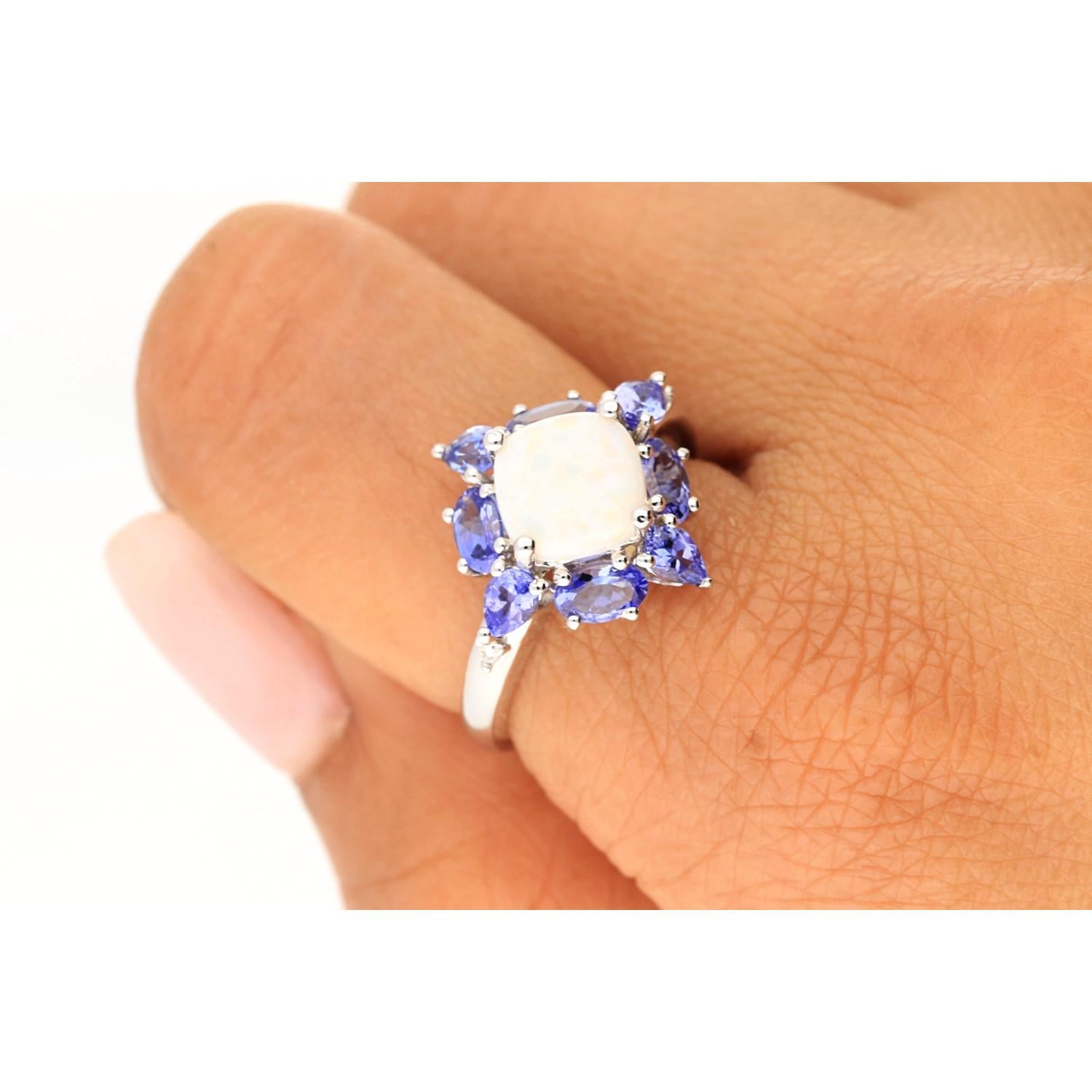 Stunning, timeless and classy eternity Unique Ring. Decorate yourself in luxury with this Gin & Grace Ring. The 14K White Gold jewelry boasts with Oval-cab Ethiopian Opal 1 pcs 1.63 carat, Tanzanite 8 pcs 1.55 carat, Natural Round-cut white Diamond