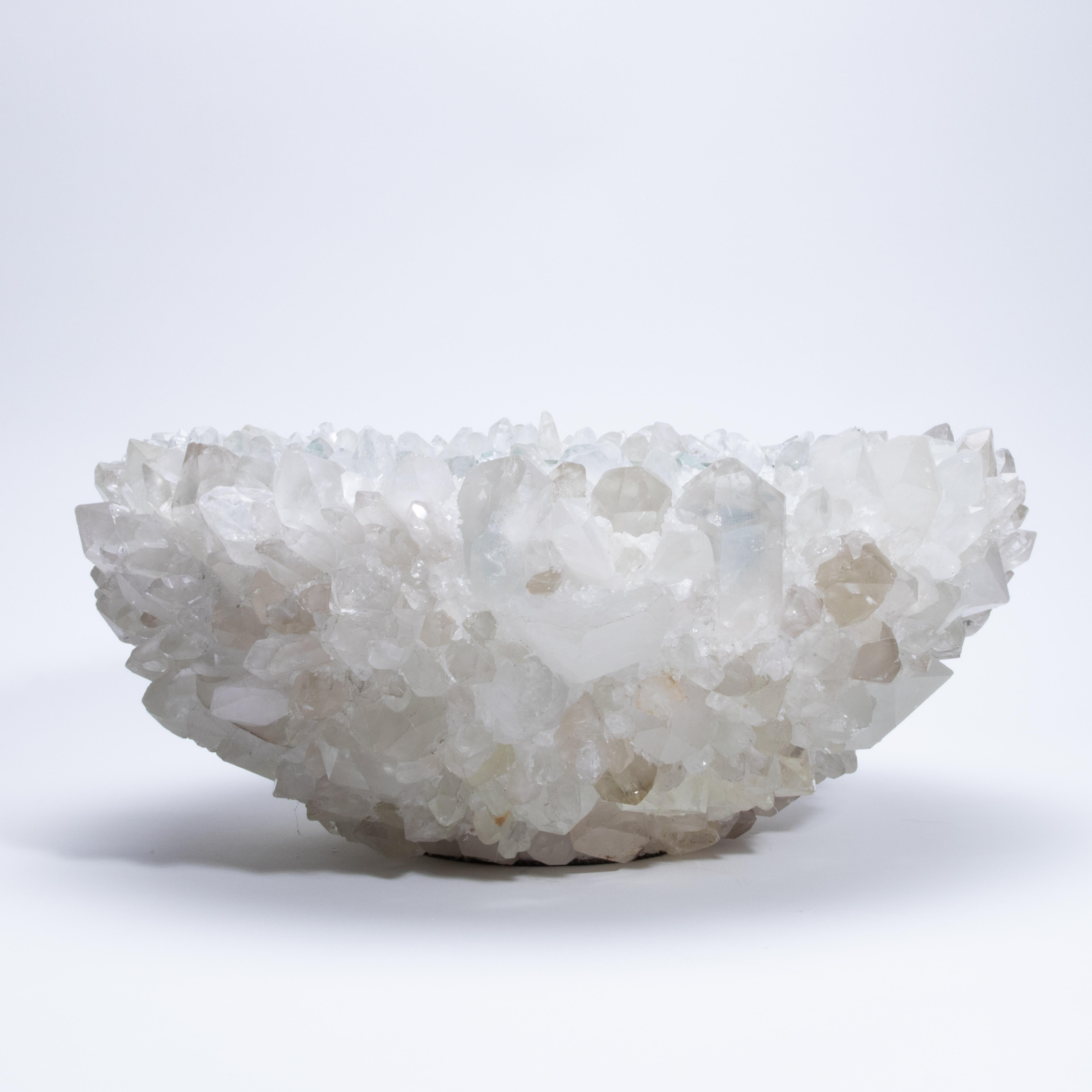 Glowing with quiet brilliance, the Classic Large Bowl in Clear Quartz by Kathryn McCoy exudes an elemental elegance that feels both grounded and celestial. Handcrafted from clusters of luminous clear quartz and finished with a smooth, glass-lined