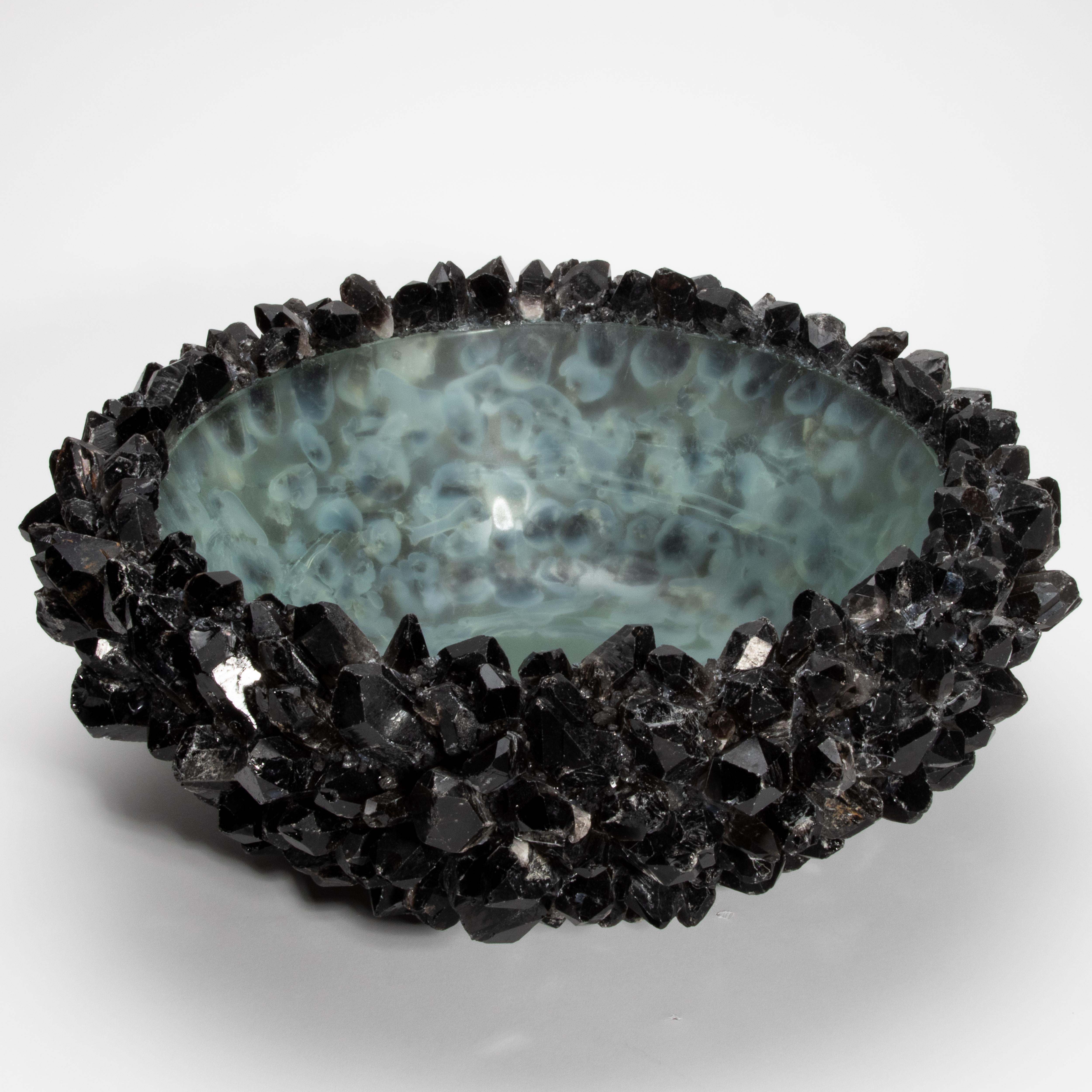 Bold, tactile, and richly elemental, the Classic Extra Large Bowl in Black Quartz by Kathryn McCoy is a striking fusion of raw nature and refined design. Each piece is handcrafted using jagged black quartz crystals that burst outward from a smooth,