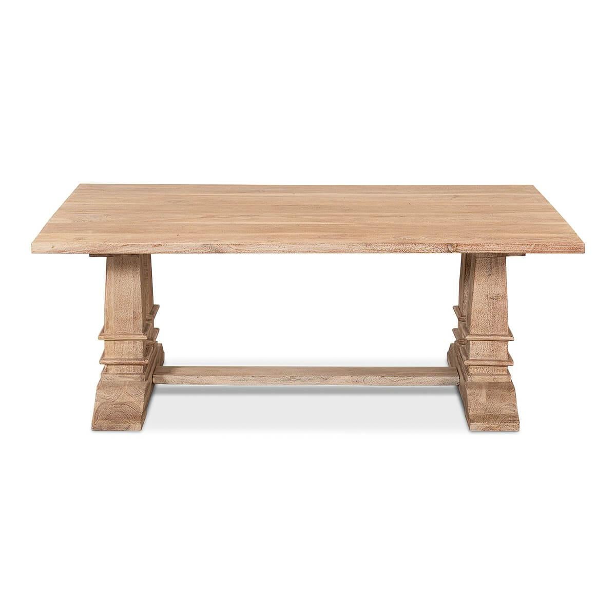 Classic natural rustic farmhouse coffee table with double square column form trestle ends with a stretcher. 

Dimensions: 53