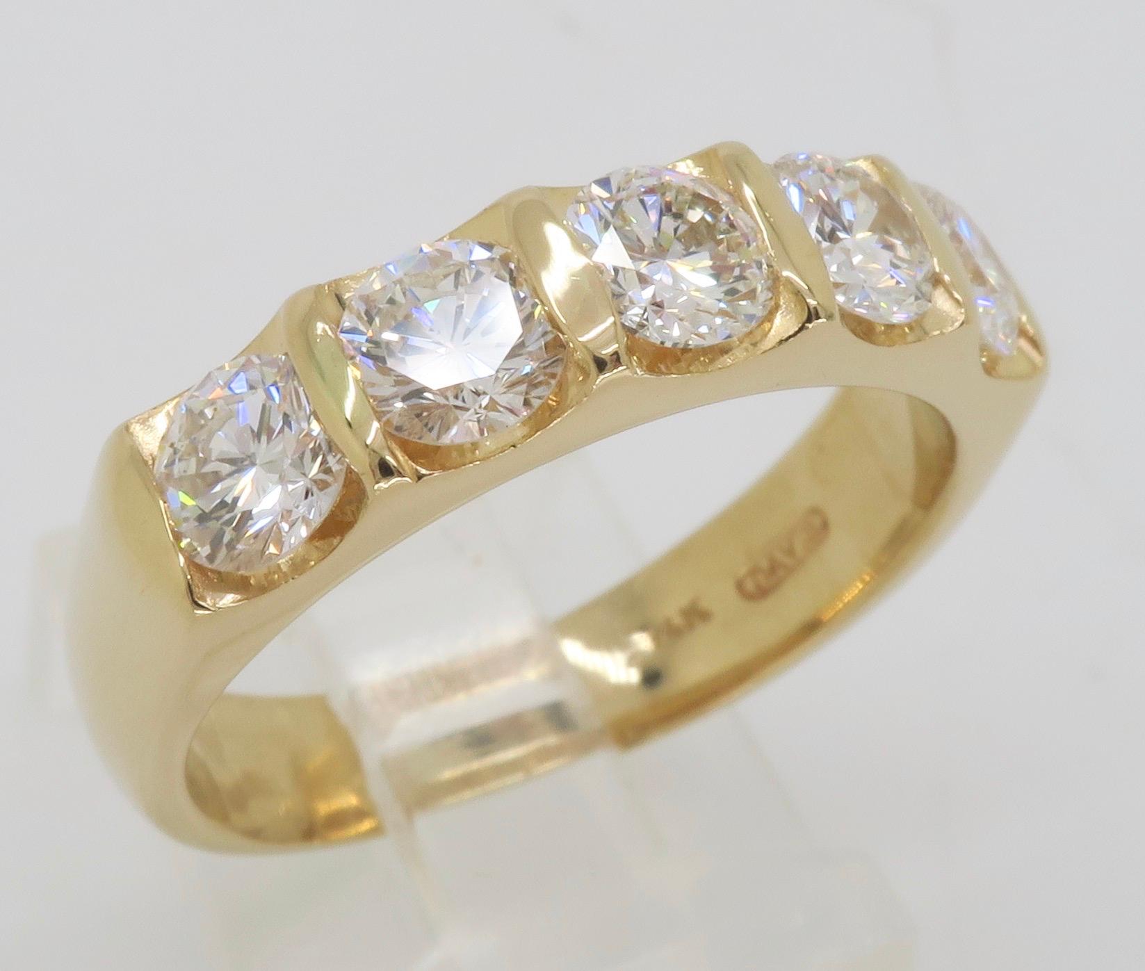 Incredible five stone diamond ring made in 14k yellow gold. 

Diamond Cut: Round Brilliant Cut
Total Diamond Carat Weight: Approximately 1.75CTW
Average Diamond Color: F-H
Average Diamond Clarity: VS
Metal: 14k yellow gold 
Marked: “14k” “DAVIS”