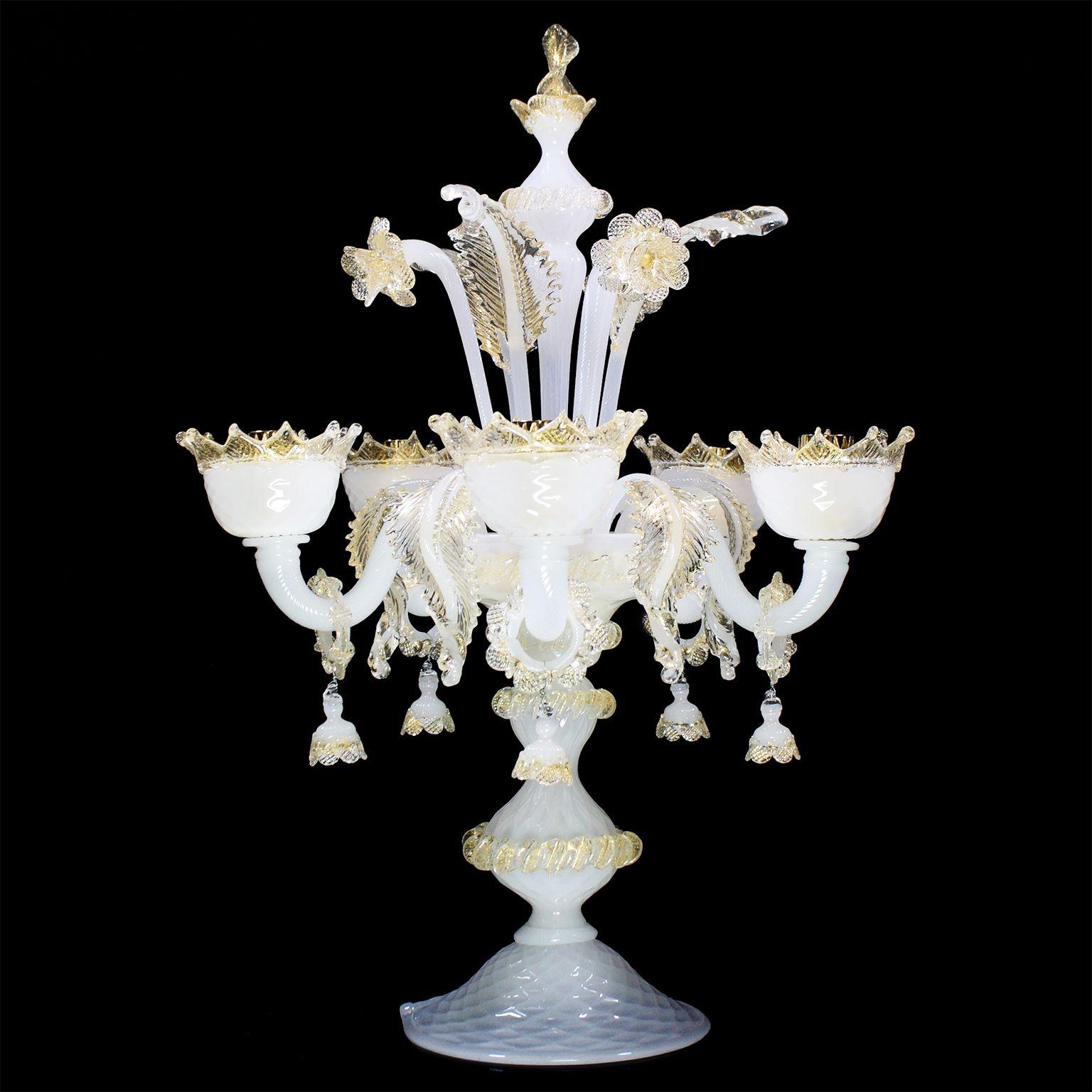 Classic Flambeau 5 arms white silk Murano glass gold details by Multiforme.
V-Classic 800 collection is designed with attention to details, and with the passion that makes us standing out. Each product (from the monumental chandeliers to the