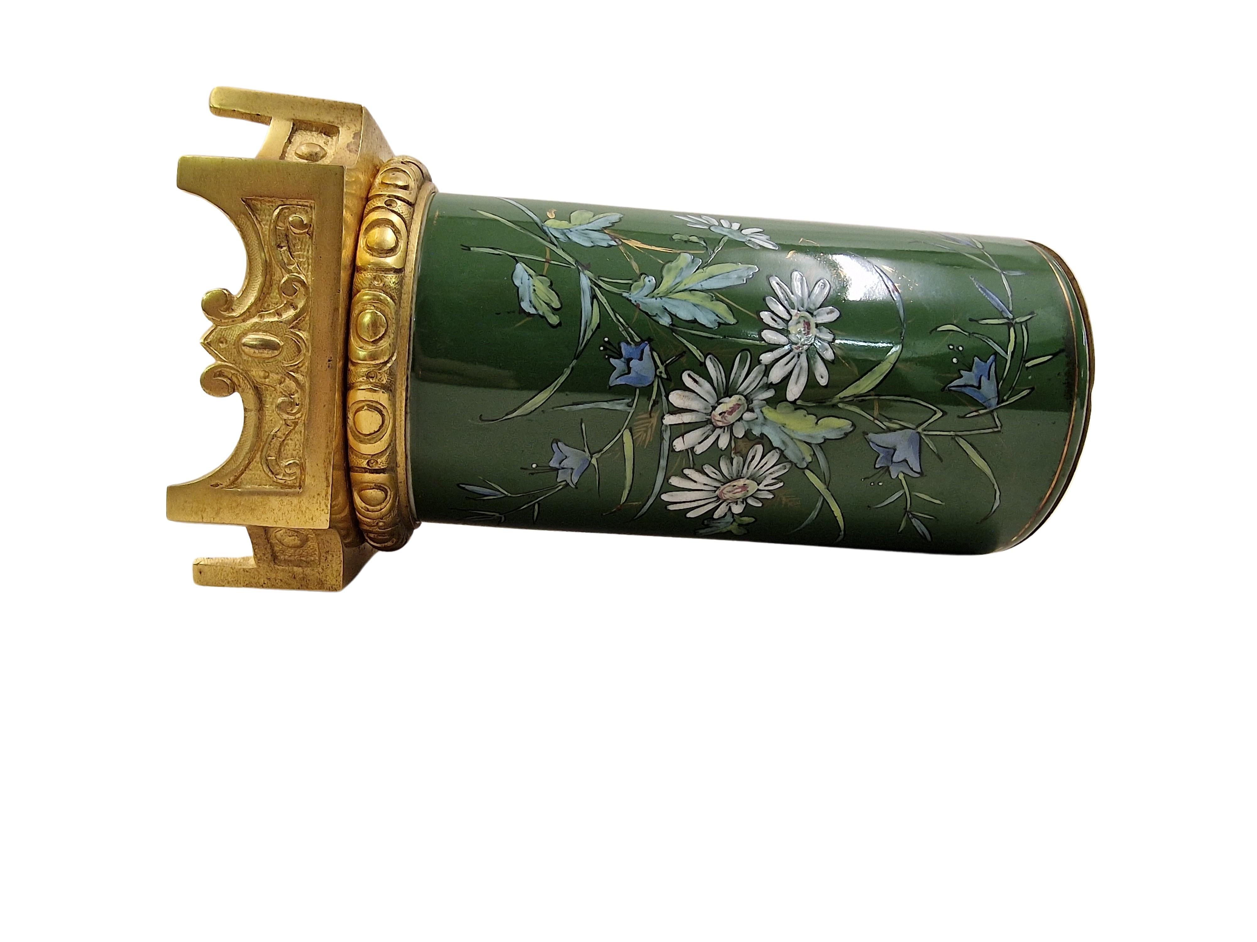Stunning flower vase, made out of metal, elaborately hand enamel painted, the base is firegilt, a French masterpiece, made around 1870 at the time of Napoleon III.

This vase is a true masterpiece, it is of yellow metal, the square base is