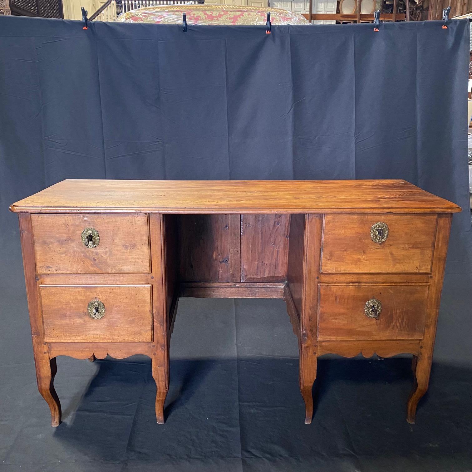 Found near Paris, France, we purchased this museum quality 18th century Empire style desk for its impeccable quality and style. Made predominantly from walnut and featuring Empiric style lines and columnal tapered legs, this piece is perfect for any