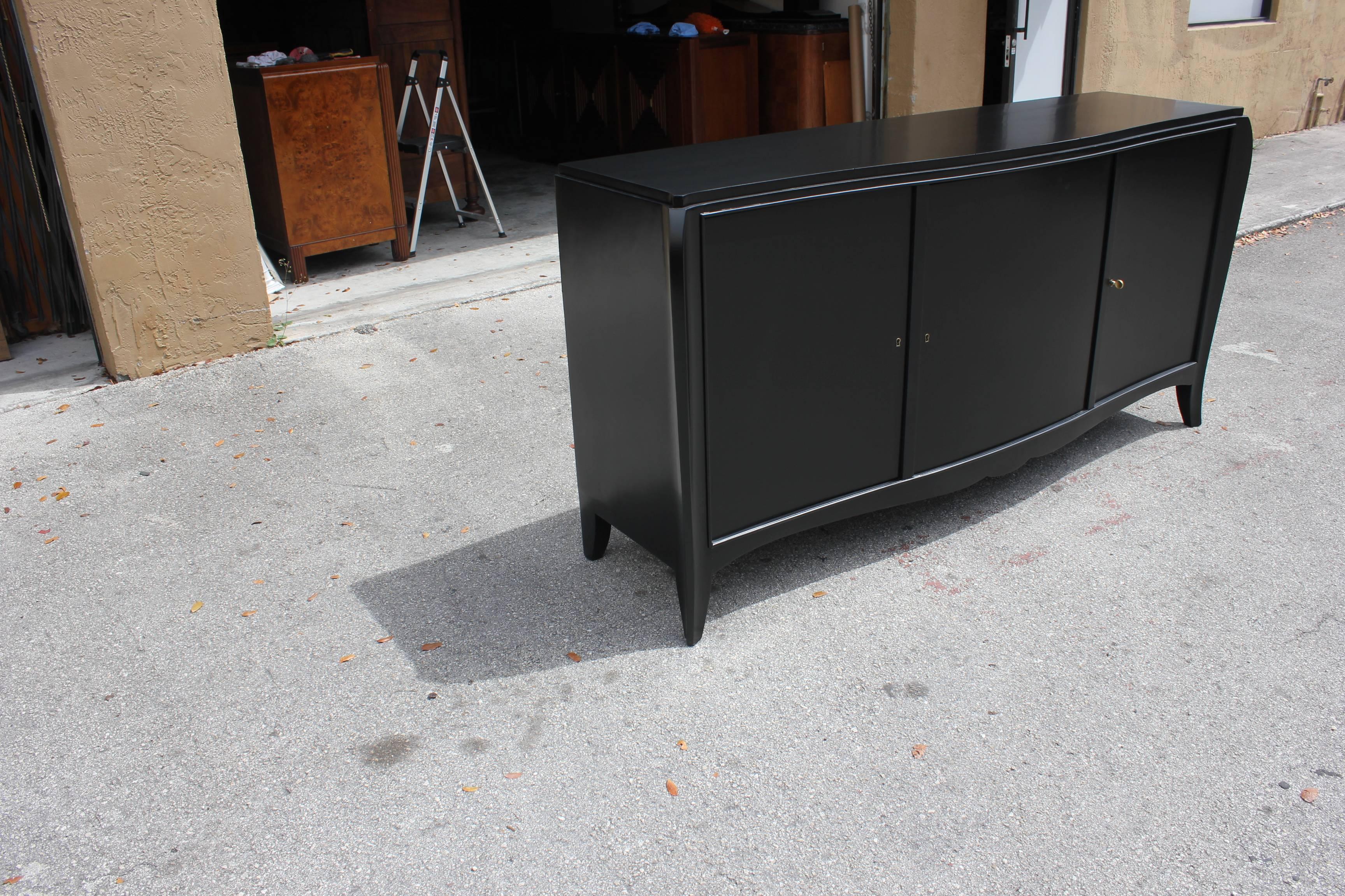 Beautifully French Art Deco, sideboard, buffet or bar or credenza ebonized finish, circa 1940s. Newly lacquered inside and out and the back too, with three drawers inside and shelves adjustable, and you can remove the shelves if you need more space,