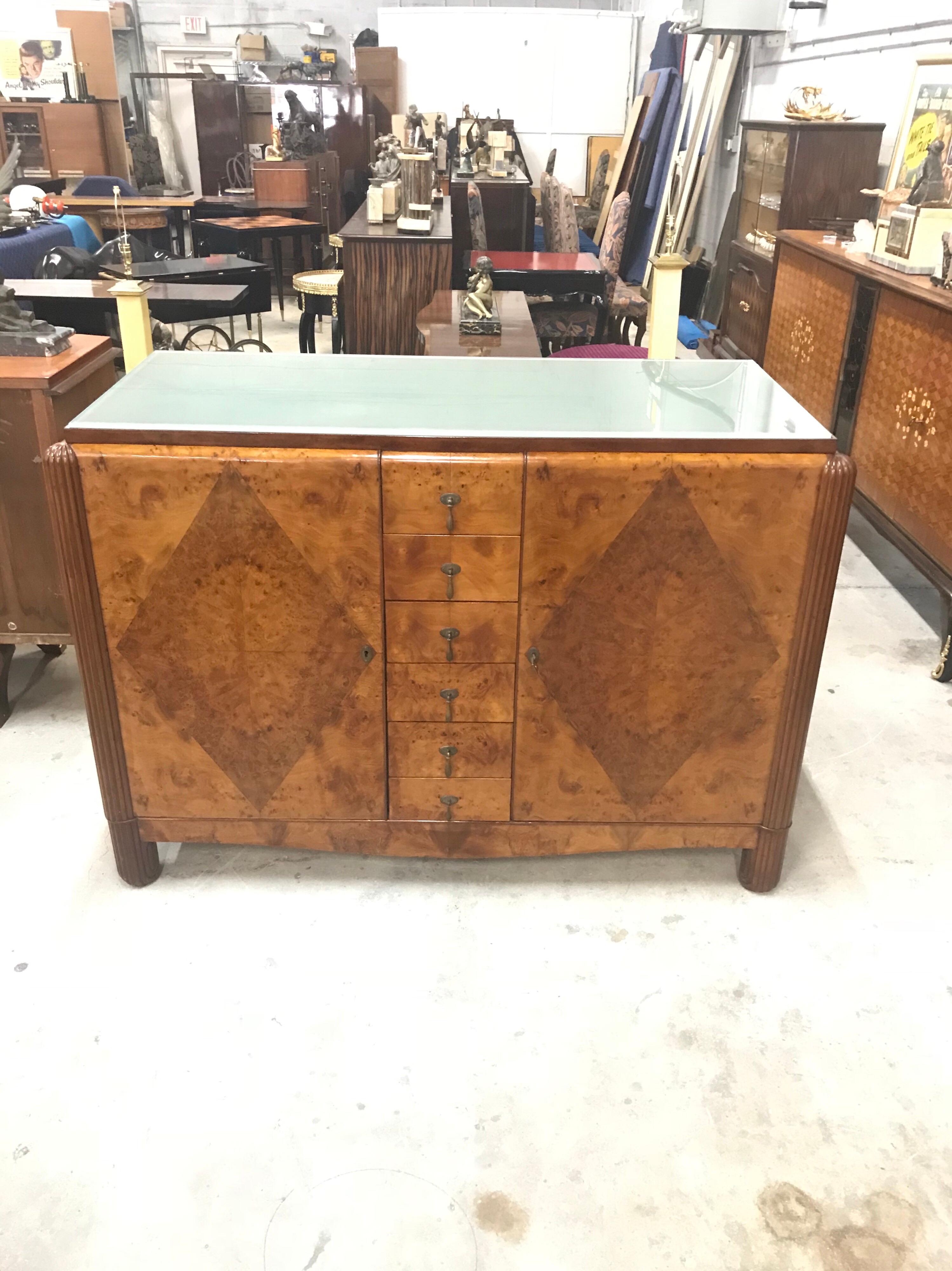 Classic French Art Deco Exotic Burl Walnut Sideboard / Buffet , circa 1940s. the sideboard are in very good condition ,beautiful art frosted glass top ,With 6 long drawers in the center, with 4 long drawers in the left side and 4 long drawers in the