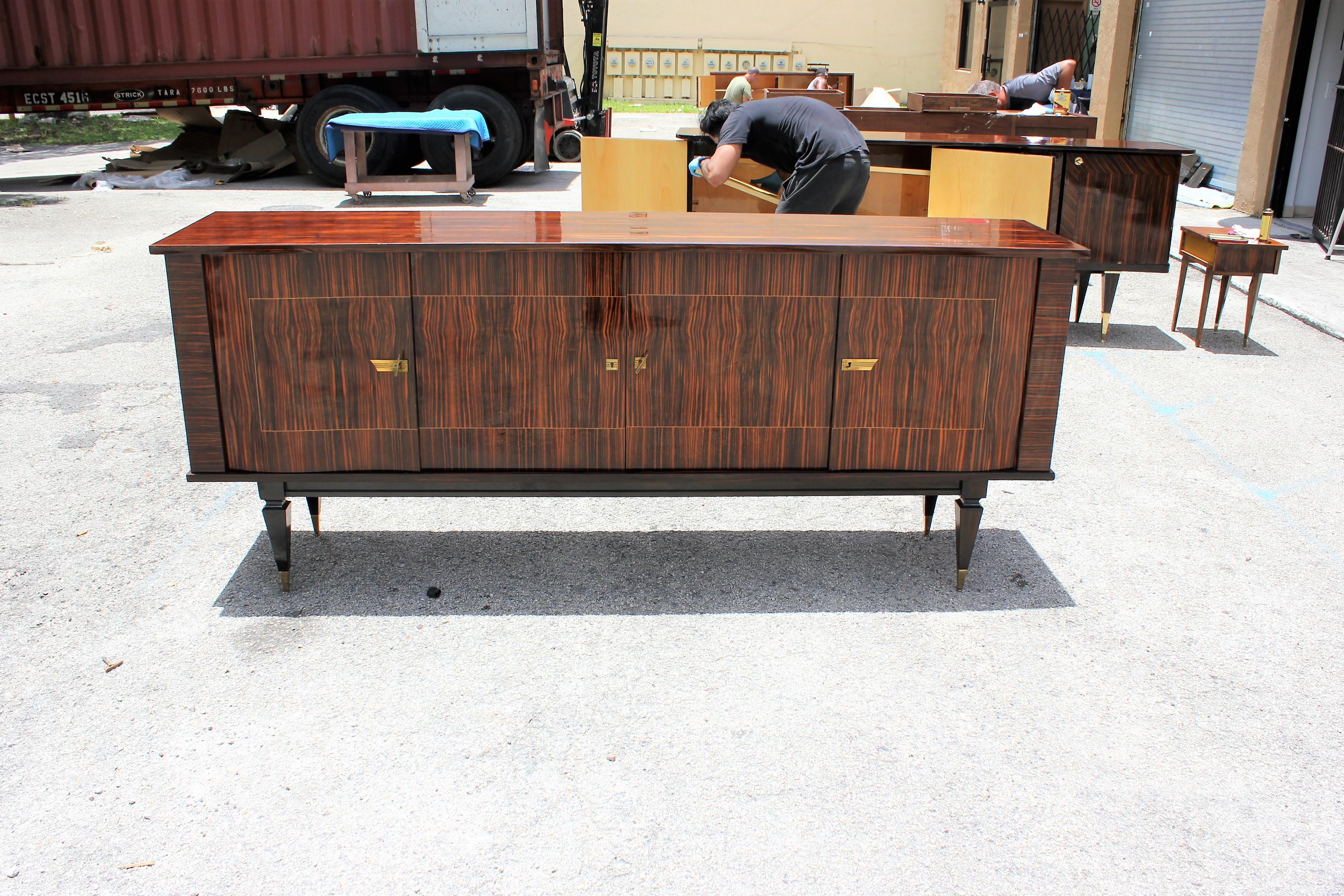 Beautiful French Art Deco exotic macassar ebony sideboard / buffet, circa 1940s. very nice door design ,the sideboard are in very good condition ,With two drawers inside, with two shelves adjustable, you can remove all the shelves if you need more