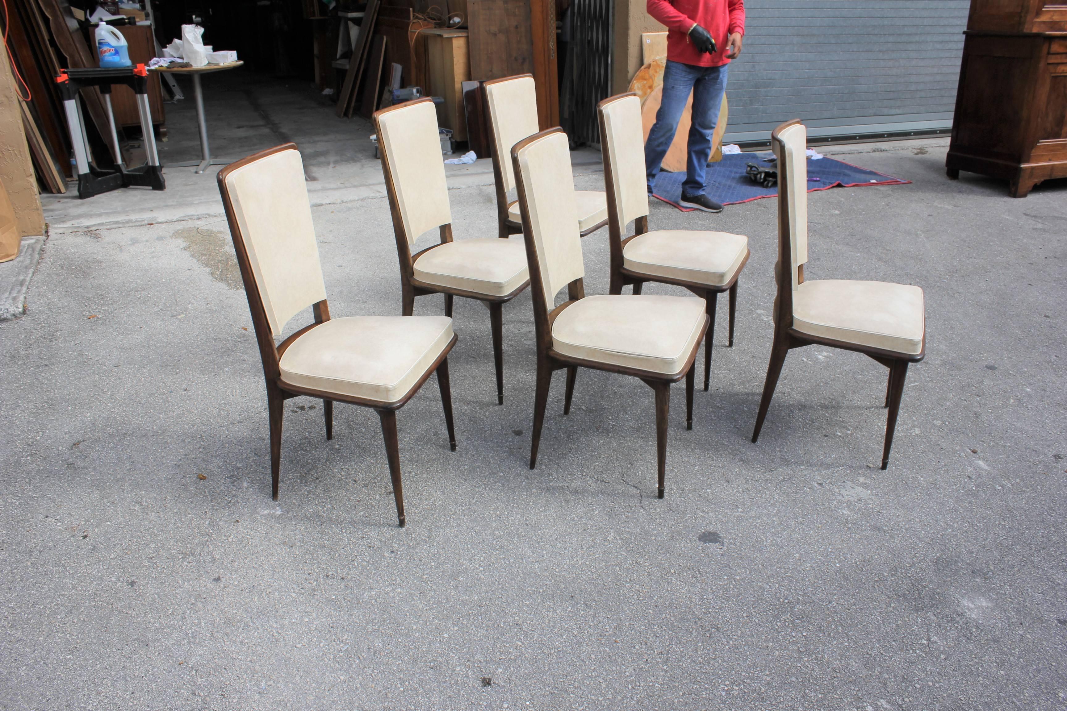 Description set of six French Art Deco dining chairs solid mahogany, circa 1940s, the chair frames are in excellent condition. Reupholstery is vinyl recommended for all six dining chairs, but the color of the dining chairs are beautiful, circa