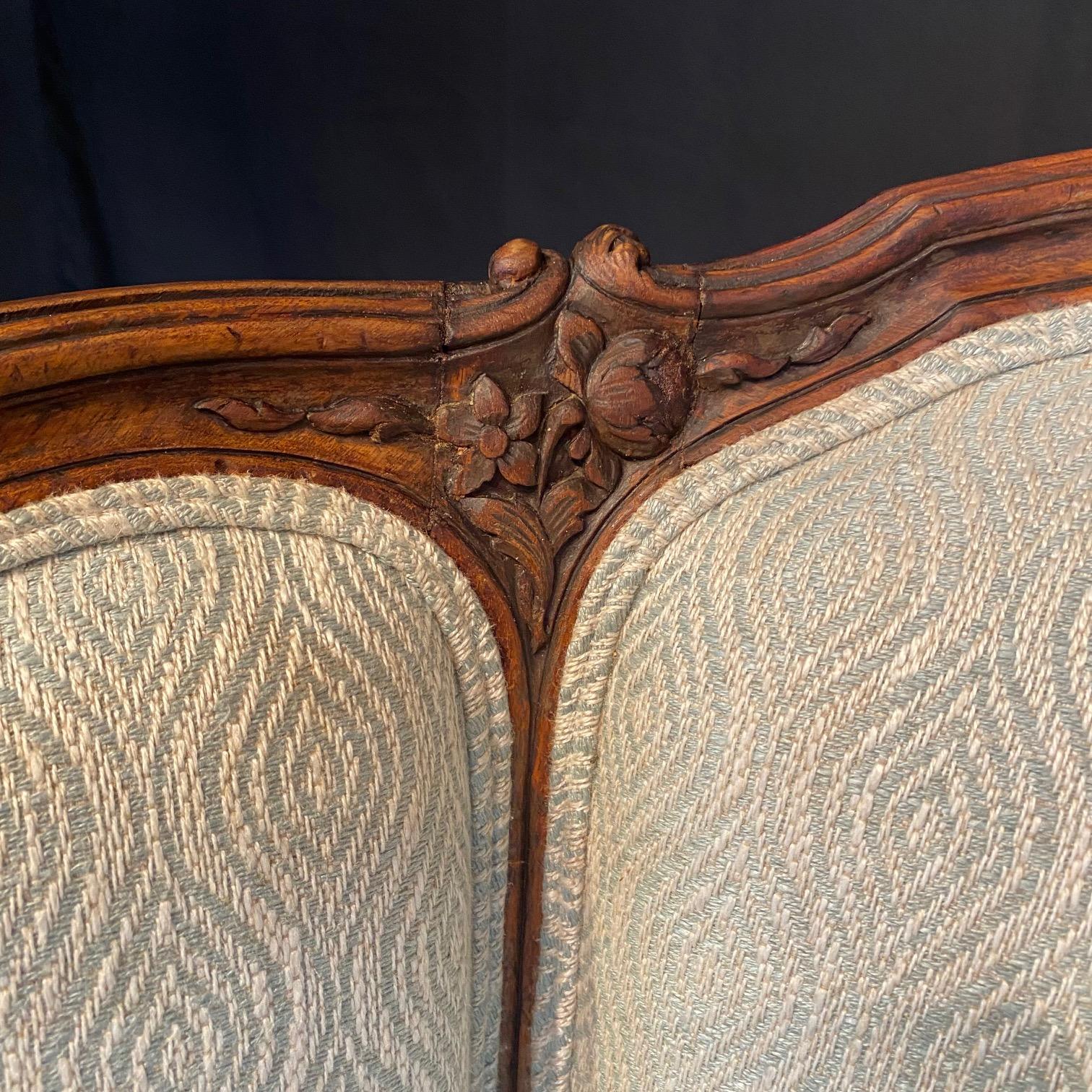 Contemporary Classic French Louis XV Intricately Carved Walnut Wing Chair For Sale