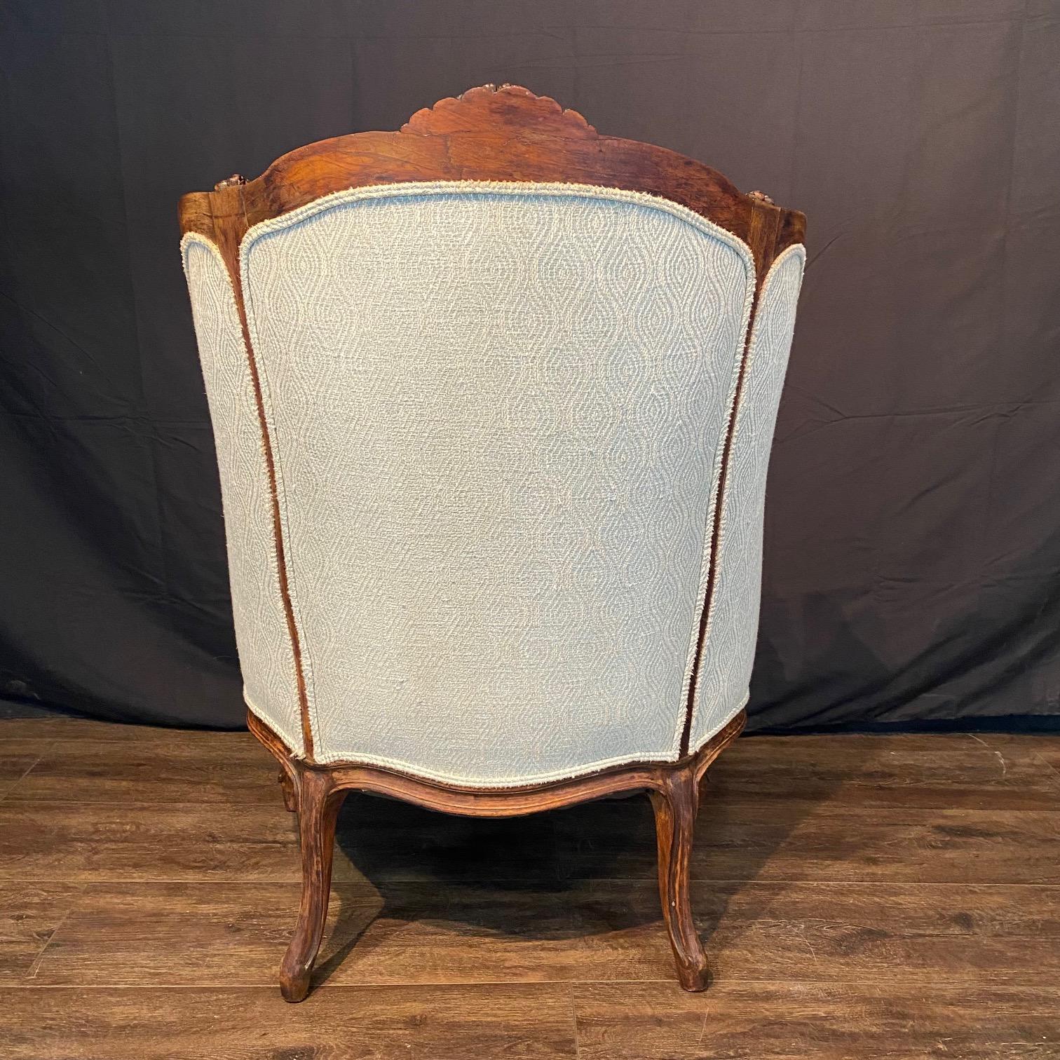 Classic French Louis XV Intricately Carved Walnut Wing Chair For Sale 3