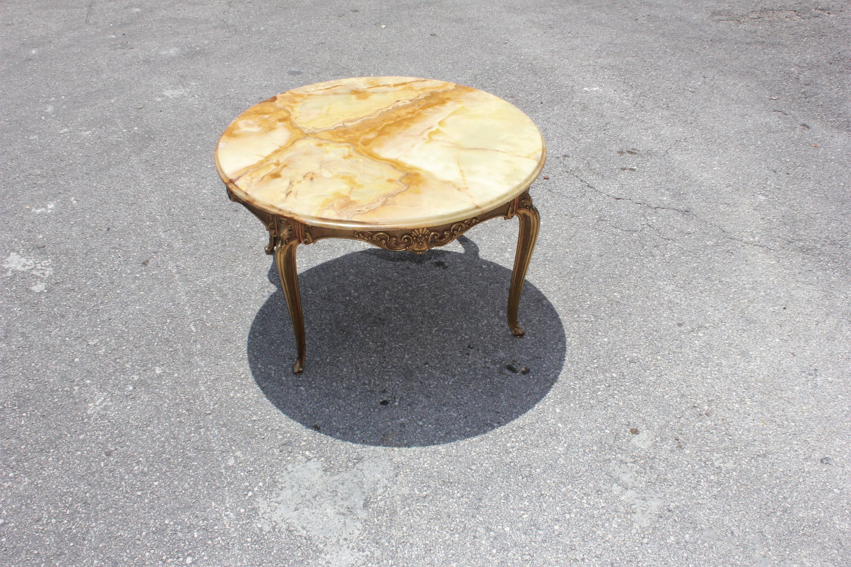 Classic French Maison Jansen round coffee or cocktail bronze table with onyx top circa 1940s, the onyx are in beautiful color green and brown with beige, the onyx and the bronze table are in perfect condition ,we traveled to buy all our pieces in