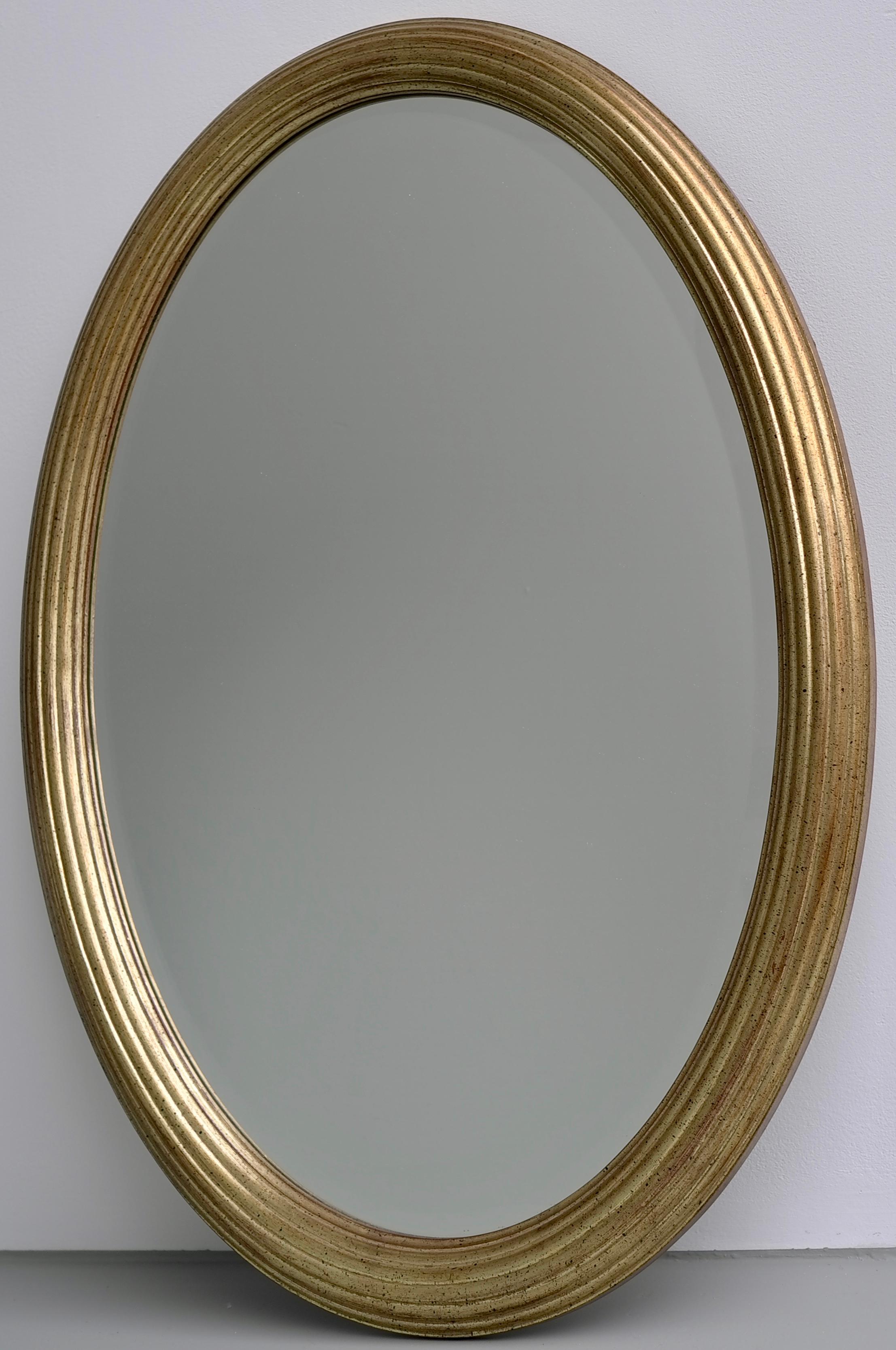 Classic French oval mirror in gold color with tiny black flakes and facet glass. You can hang this mirror vertical or horizontal.