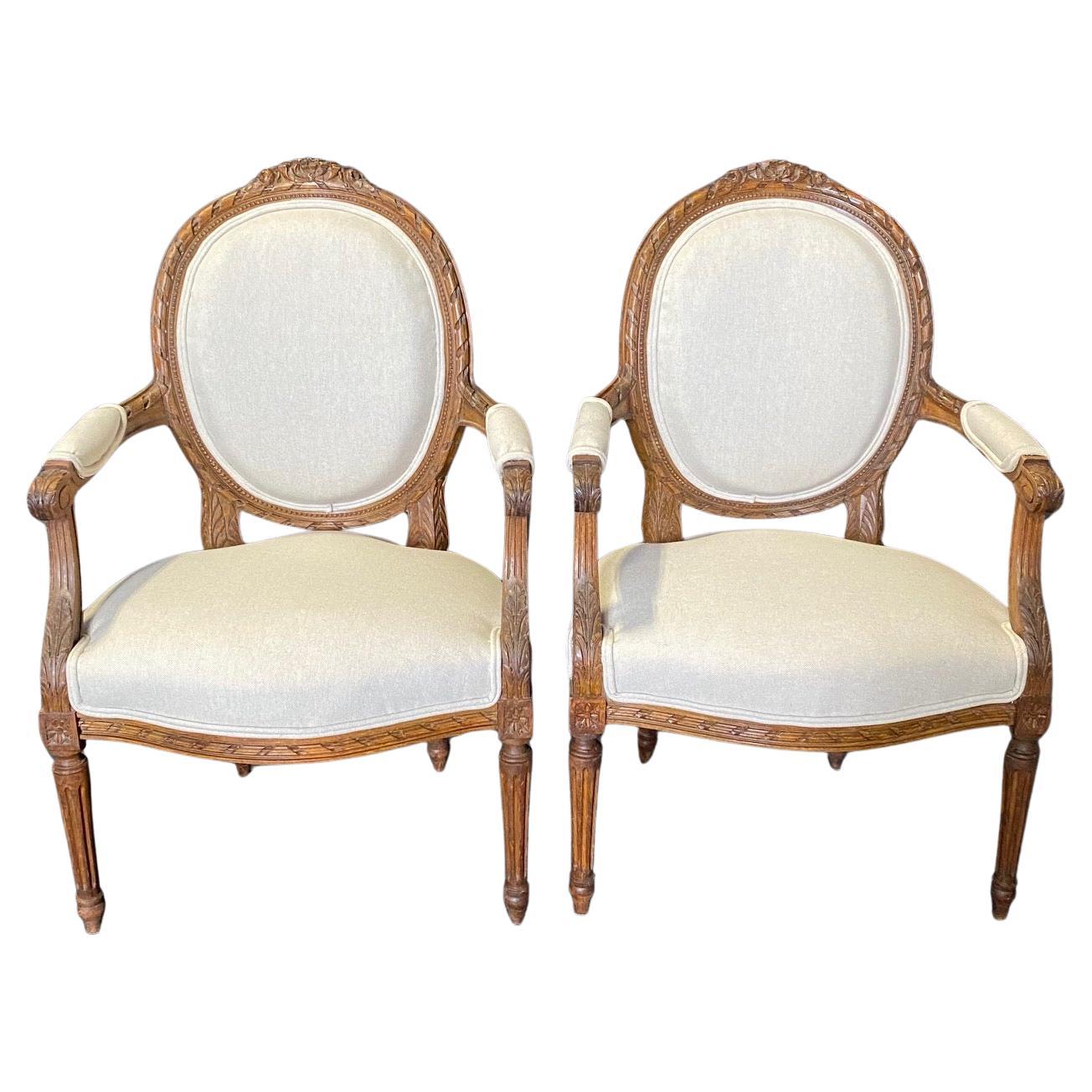 Classic French Pair of Antique Highly Carved Louis XVI Armchairs or Fauteuils  For Sale
