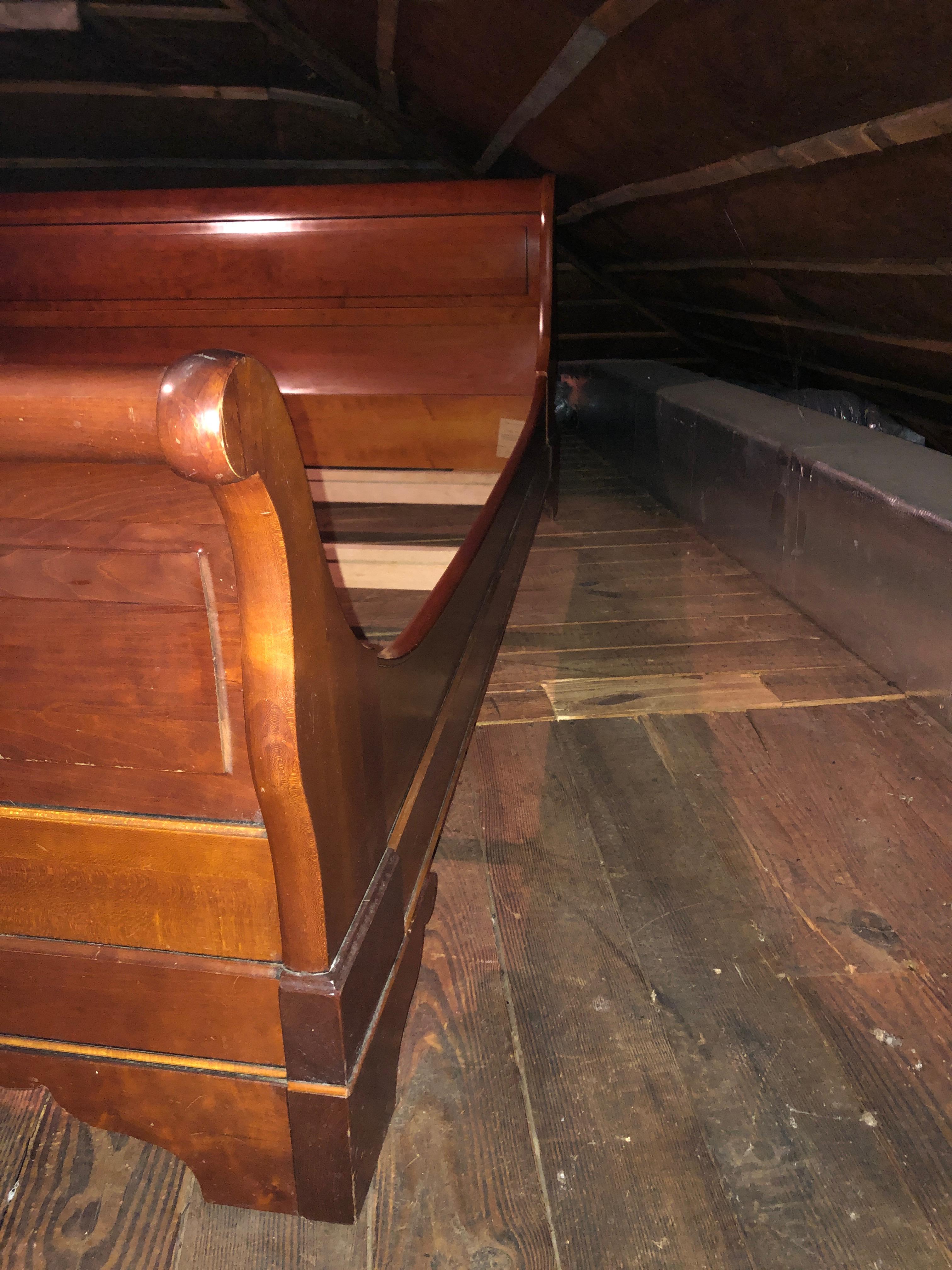 A handsome cherry Classic sleigh bed, low to the ground and sturdy, meant for a queen sized mattress and no box spring.
Measures: Headboard is 33