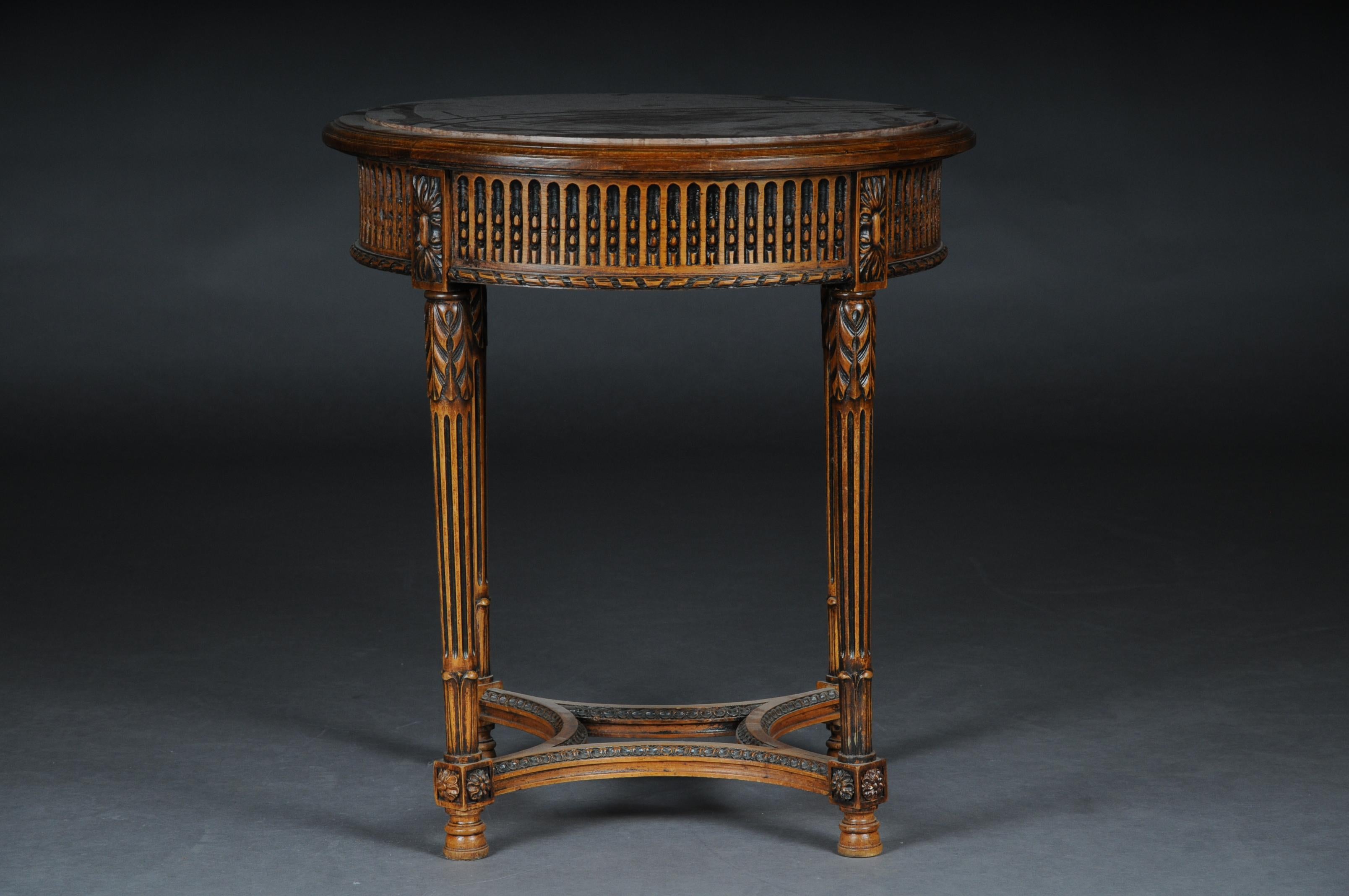 Classic French side table in Louis XVI, beechwood

Hand carved solid beechwood. Round relieved frame base on fluted legs. Below connected center bar. Round, low-profile, framed tabletop with marble slab embedded in it.
(G - 78).