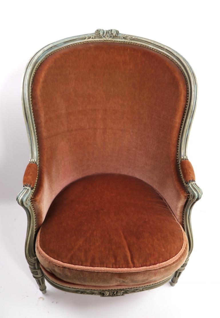 Chic French style high back Bergere form lounge chair in mohair fabric with weathered finish carved wood frame. Sophisticated, Classical, and refined , while still being fresh, modern and relavant. We believe this example is Mid Century in vintage,