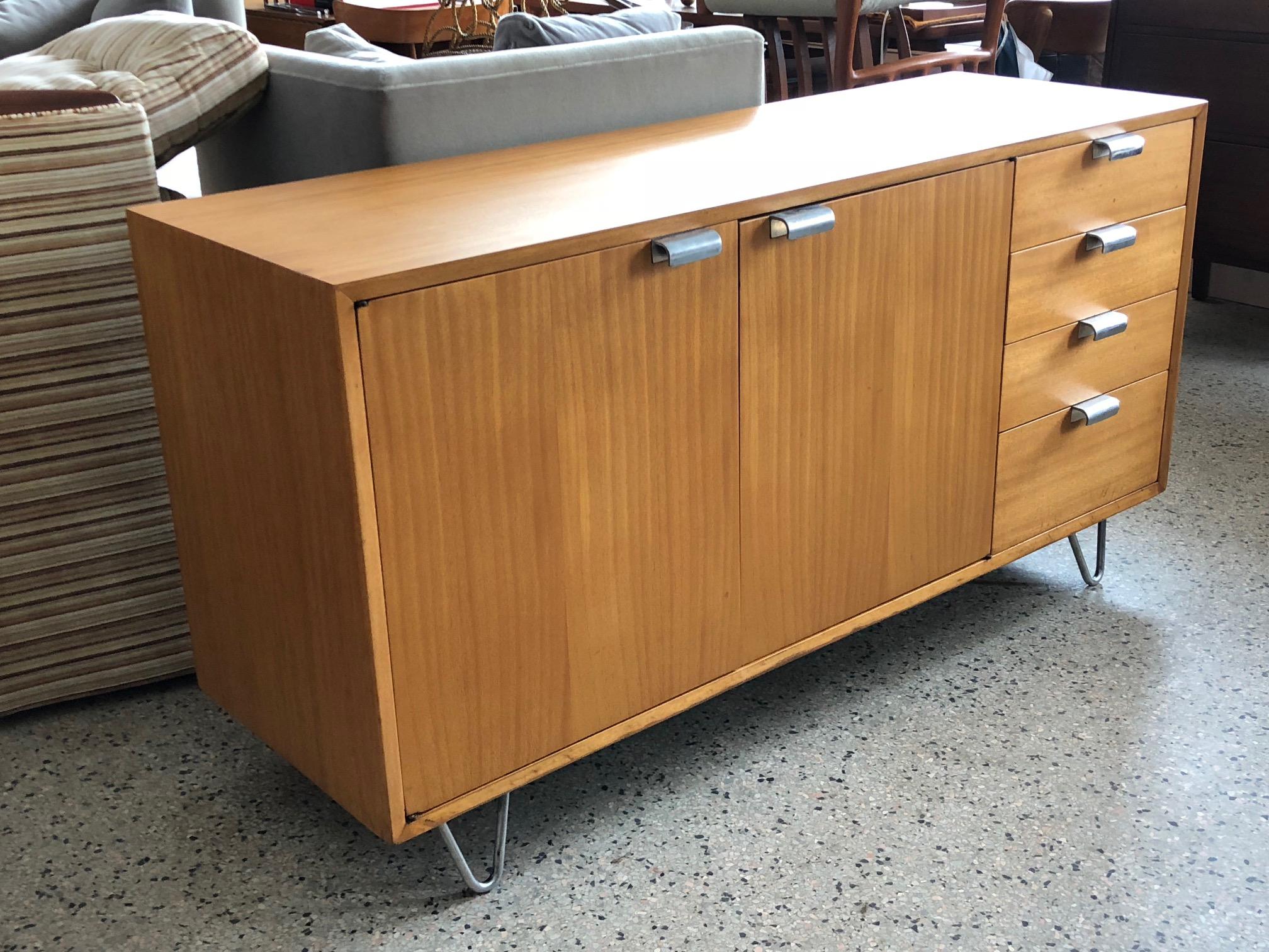 A great George Nelson credenza for Herman Miller, circa 1950s. Primavera with original hardware and rare harpin legs. Completely restored, hardware polished.