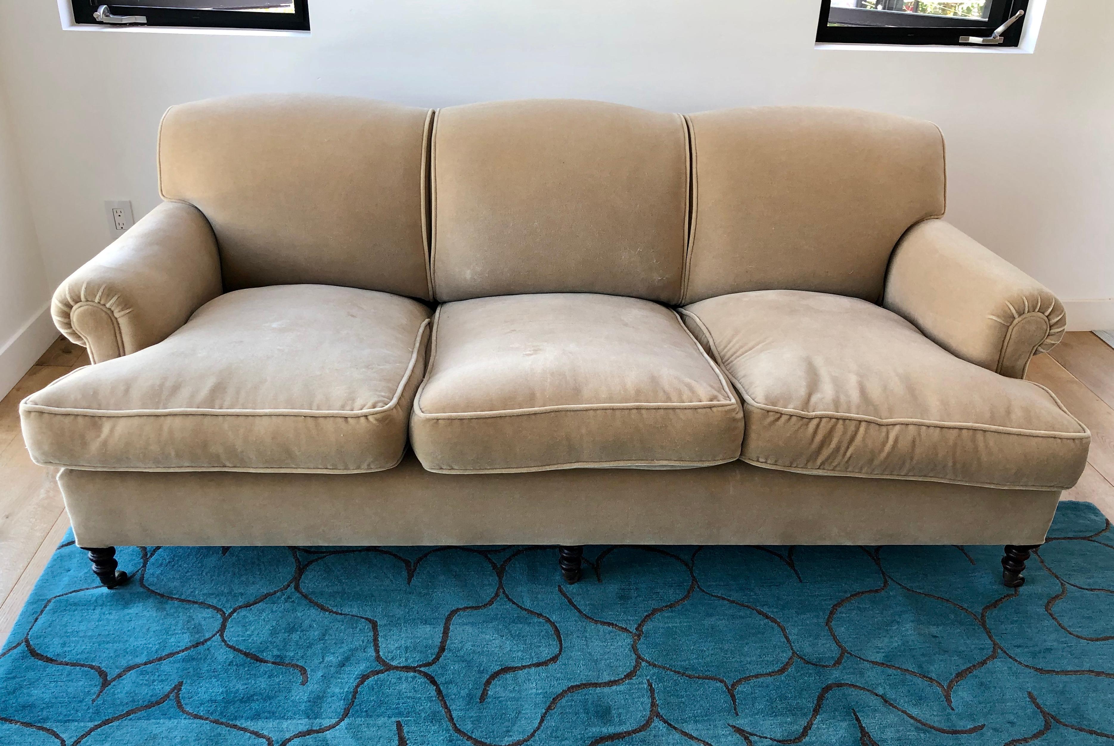 Beautiful elegant sofa by George Smith England in light beige color, manufactured in 2010 retains label and brass tag nice clean condition, no stains or fade. Priced to sell.
