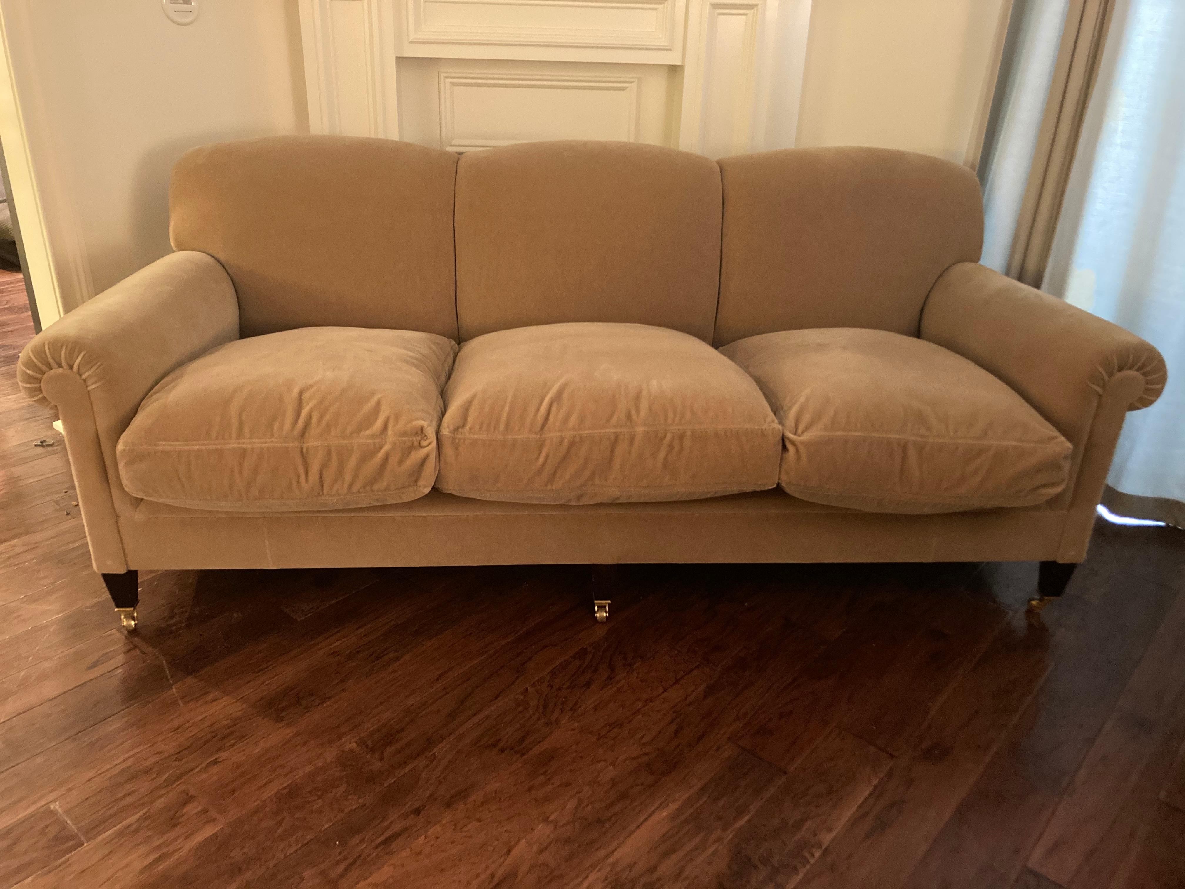A super comfortable large Classic signature full scroll arm mohair sofa upholstered in camel mohair velvet having 3 plush down filled seat cushions and 3 fixed back cushions with mahogany legs on brass casters. 
inside width arm to arm- 69”
Arm to