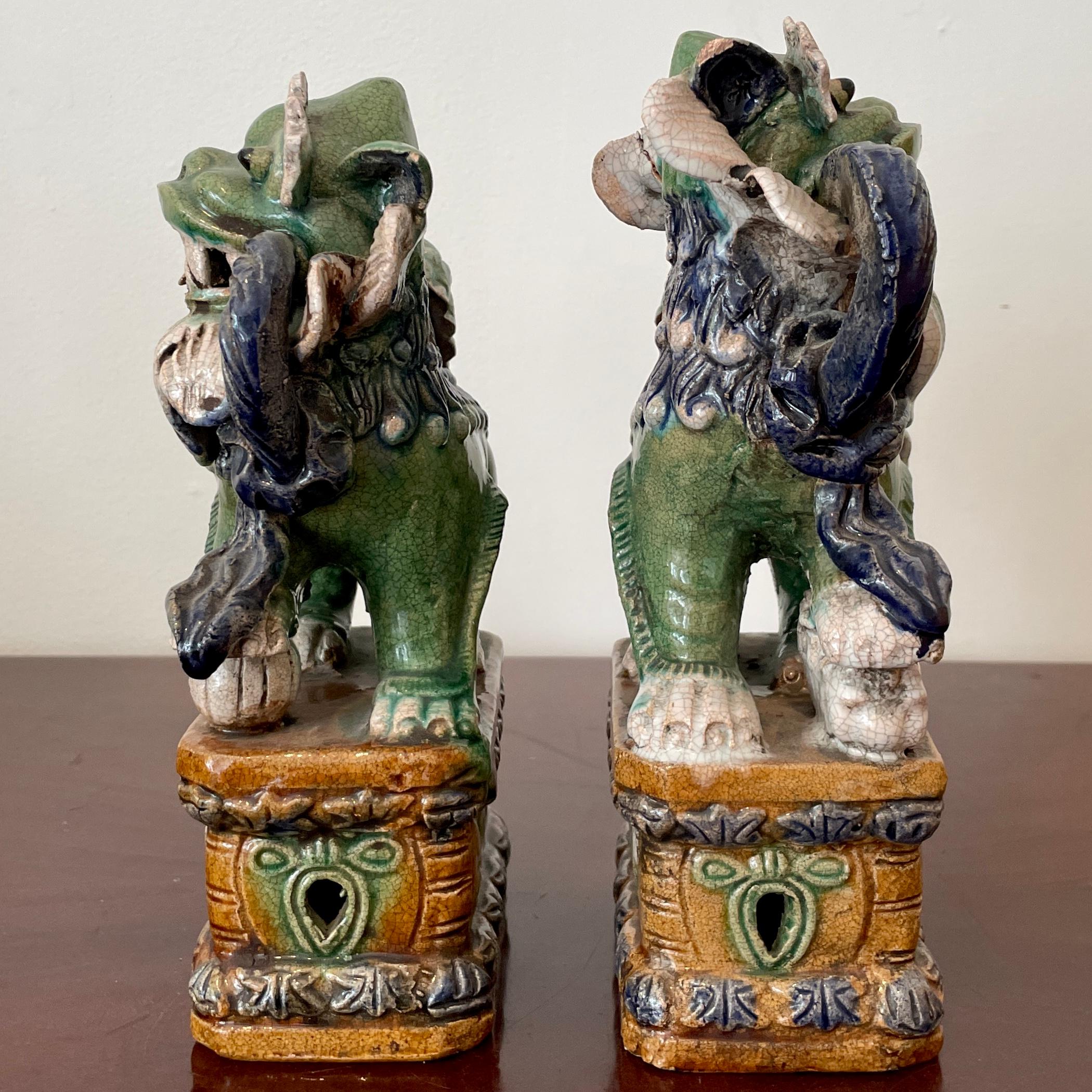 Other Classic Glazed Terra Cotta Foo Dogs on a Base, a Pair For Sale