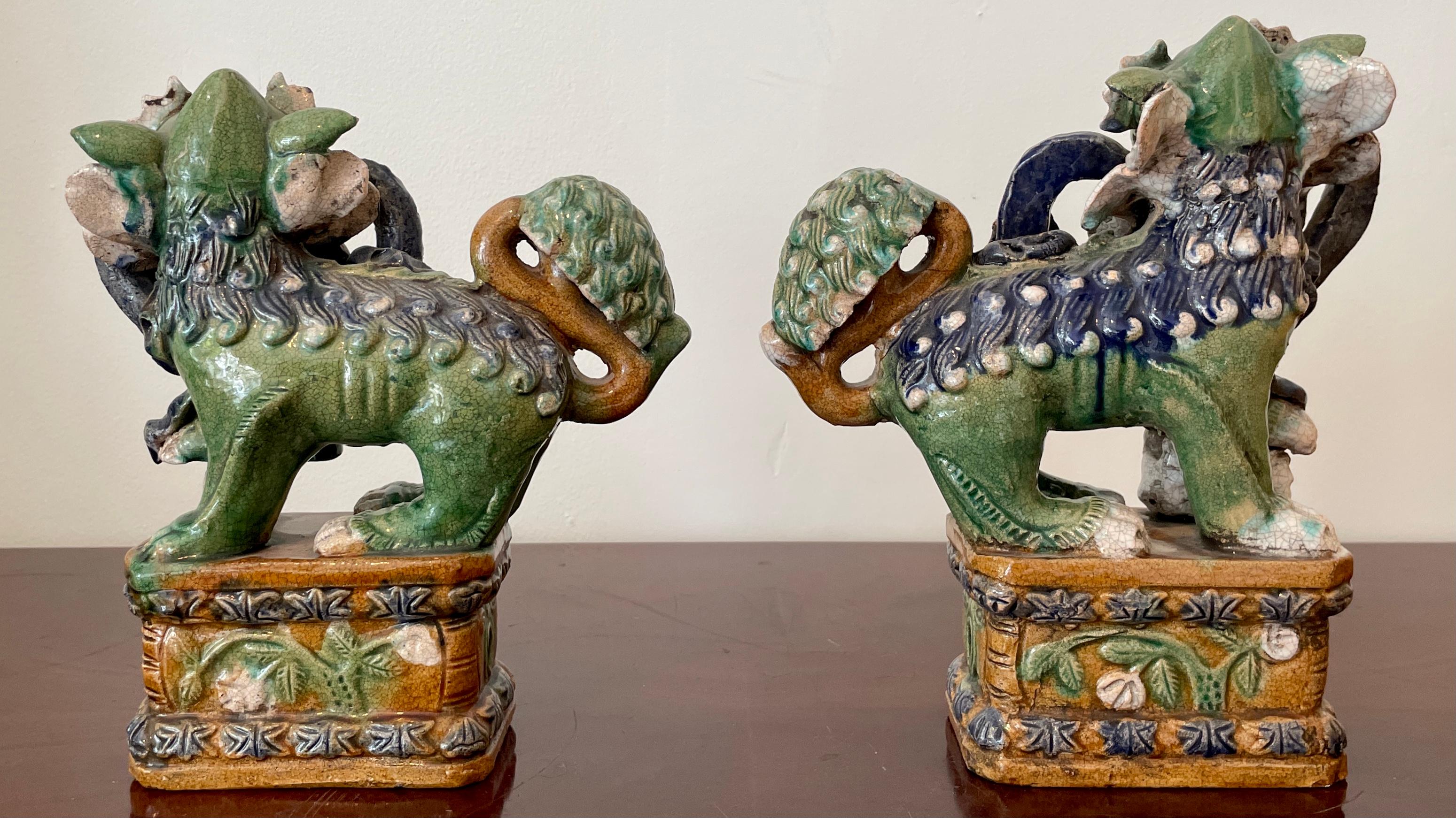 Chinese Classic Glazed Terra Cotta Foo Dogs on a Base, a Pair For Sale