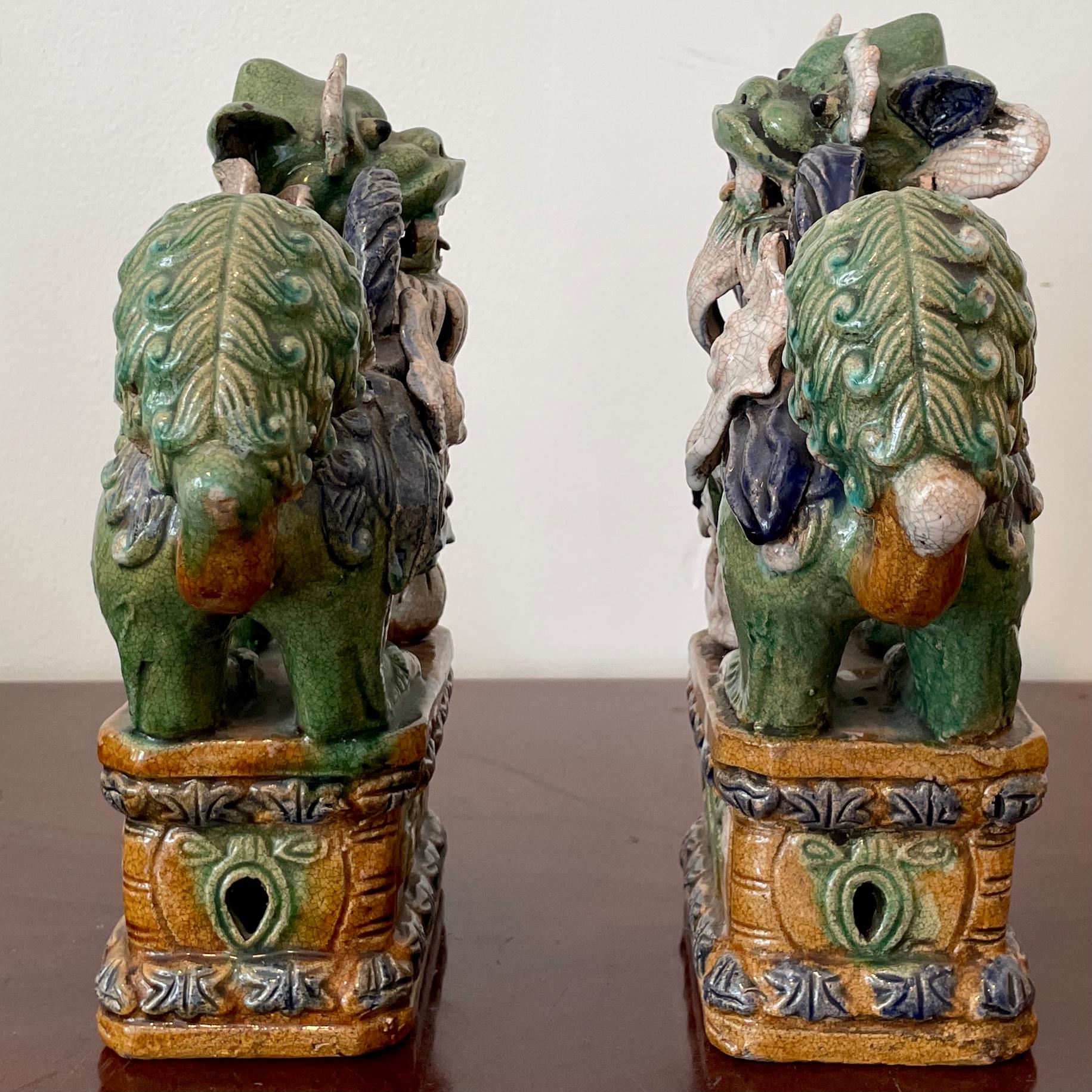 Classic Glazed Terra Cotta Foo Dogs on a Base, a Pair In Good Condition For Sale In Los Angeles, CA