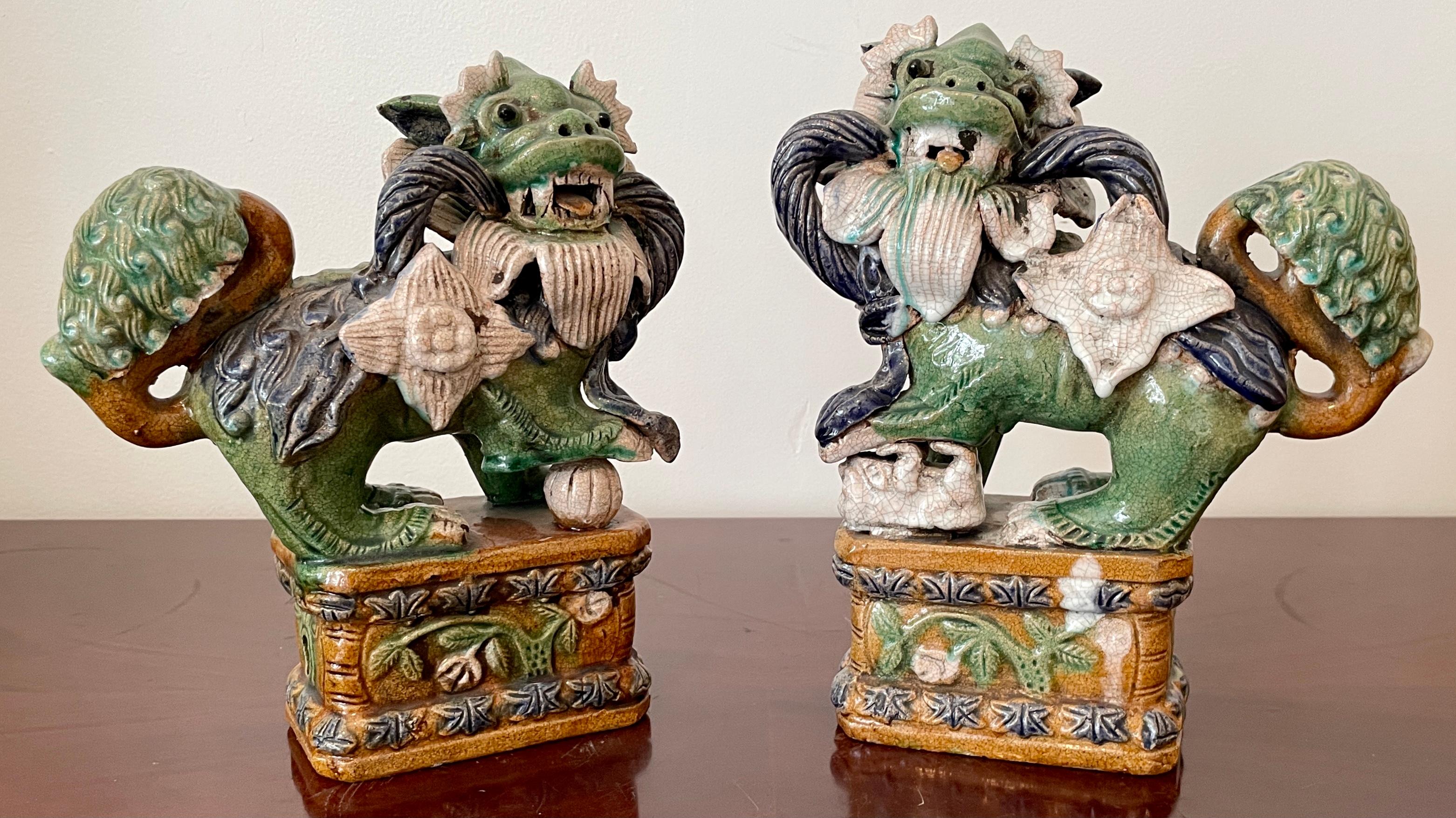 Mid-20th Century Classic Glazed Terra Cotta Foo Dogs on a Base, a Pair For Sale
