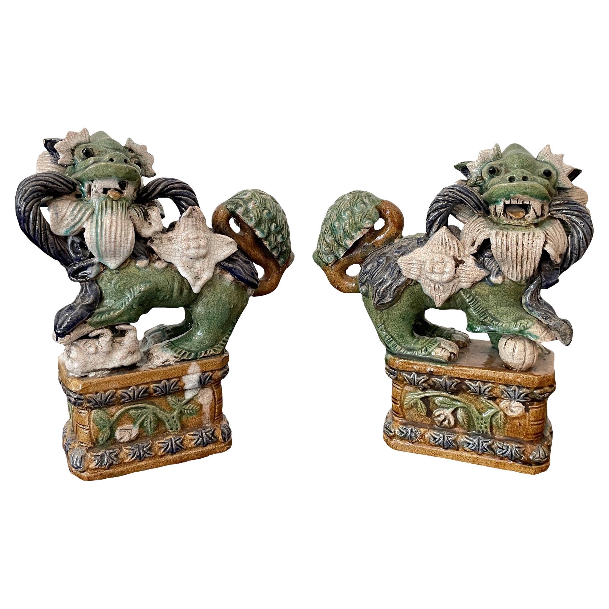 Classic Glazed Terra Cotta Foo Dogs on a Base, a Pair For Sale