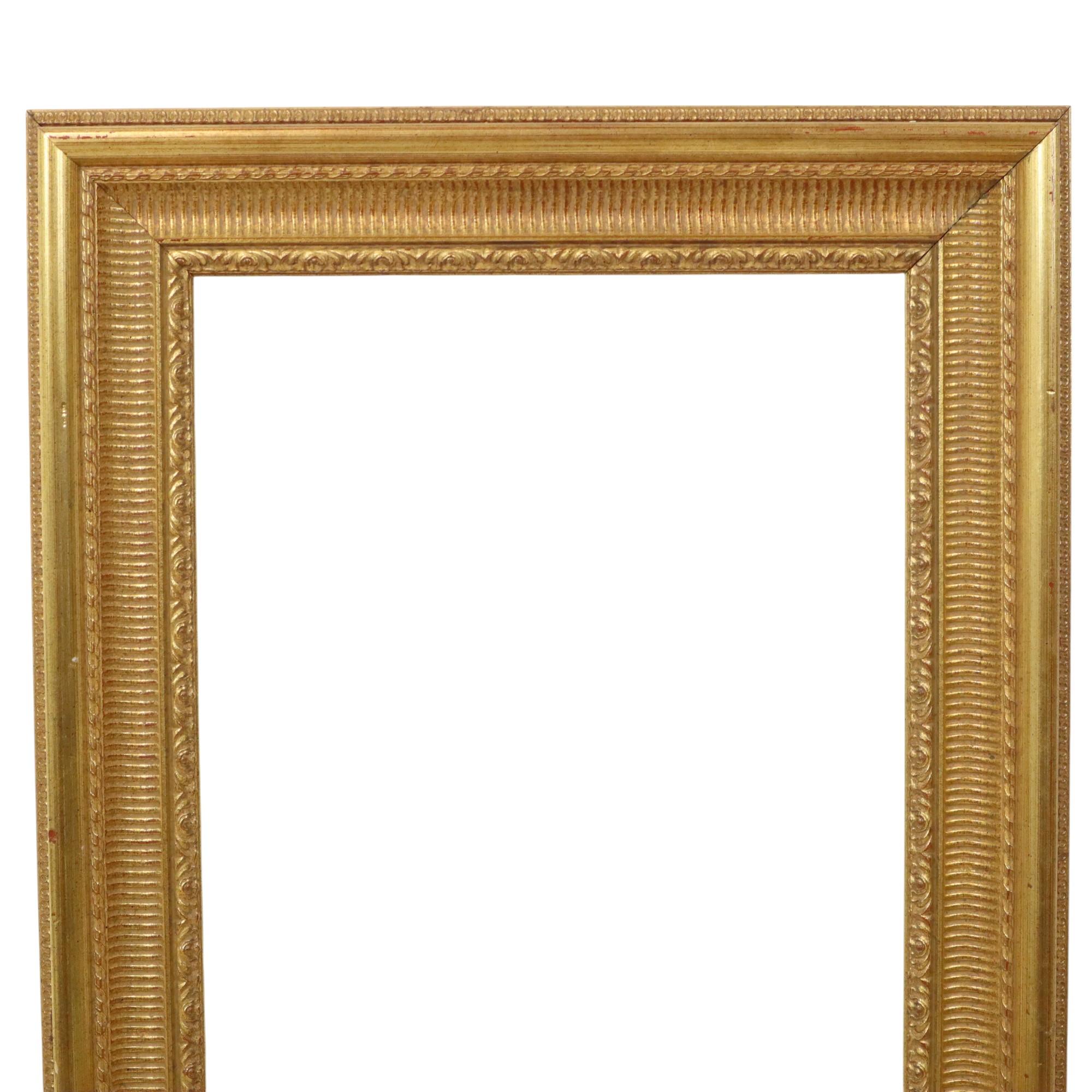 Classic gold-colored wooden frame with a beautiful patina, entirely in Baroque or Rococo style, decorated with acanthus leaves and embossed patterns. A beautiful, high-quality object from the second half to the end of the 20th century.

A lovely