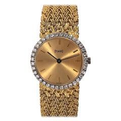 Classic Gold Piaget Watch with Champagne Dial and Diamond Bezel