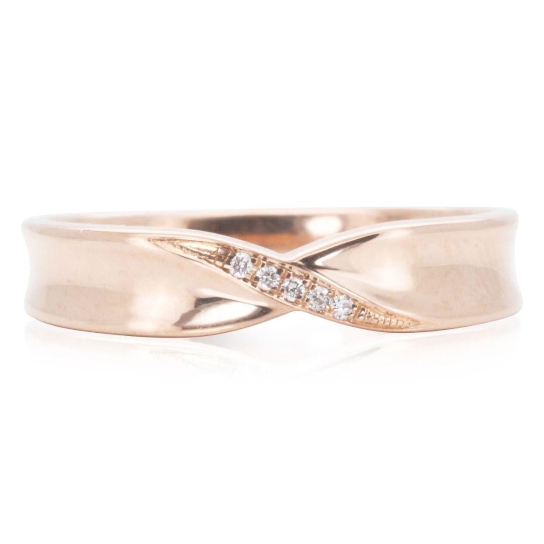This beautiful and timeless gold ring features a classic domed design with a polished finish. The band is crafted from 18k yellow gold for a lovely warm glow. Sparkling round brilliant cut diamonds are channel set into the top of the band,