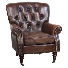 Classic grained cognac colored cowhide leather Chesterfield armchair
