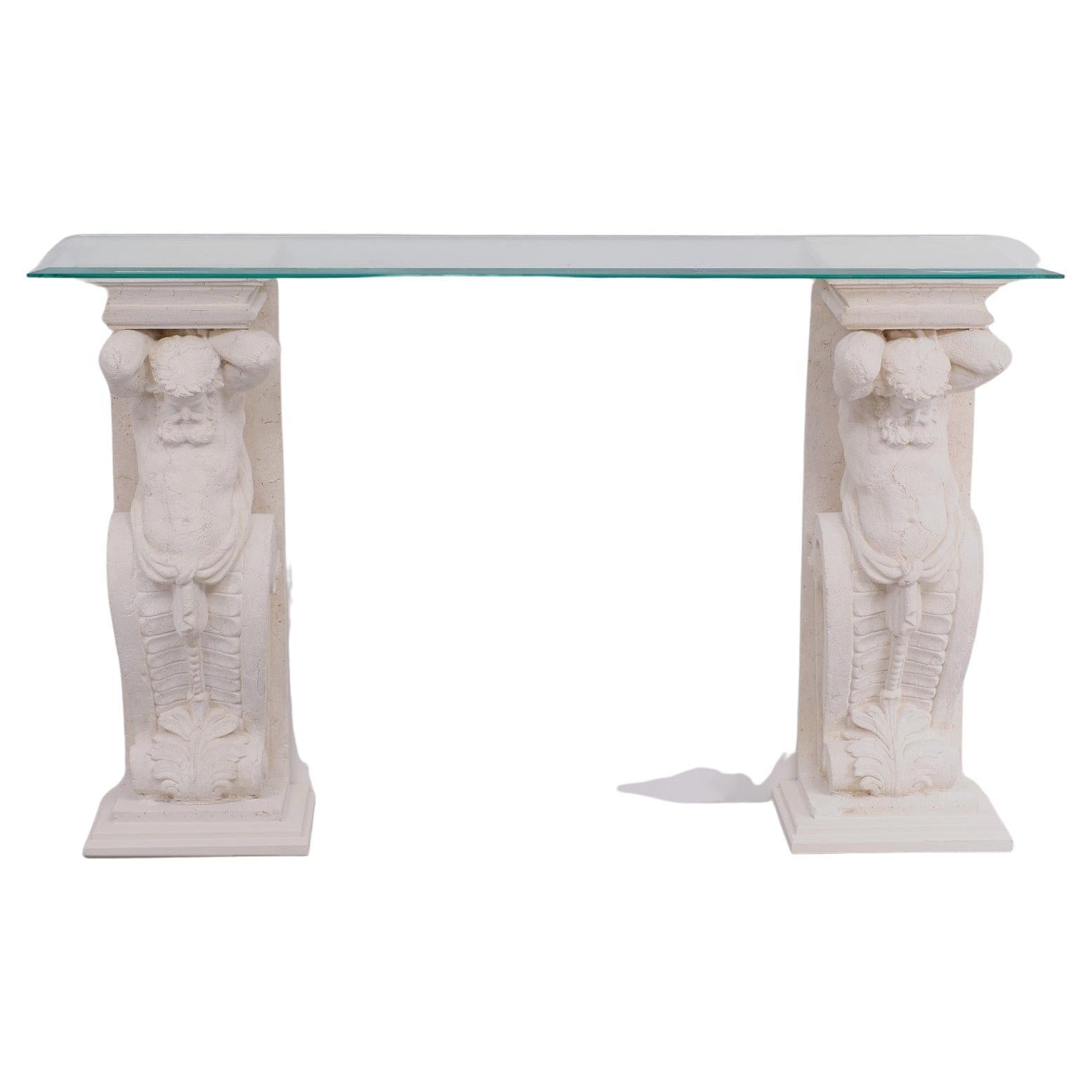 Two unique Cast Stone console tables, mythologies Greek manly figures carry en,
a beveled Glass top, so very decorative.