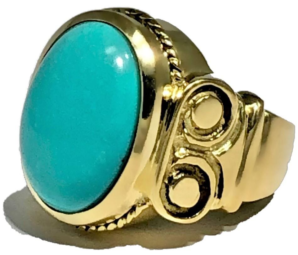 This classic, Greek revival style ring is crafted from 18k yellow gold and has, at it's center, one 18mm by 14mm low Persian Turquoise cabochon. This stone, regardless of it's age, exhibits a beautiful and evenly distributed color and a high polish