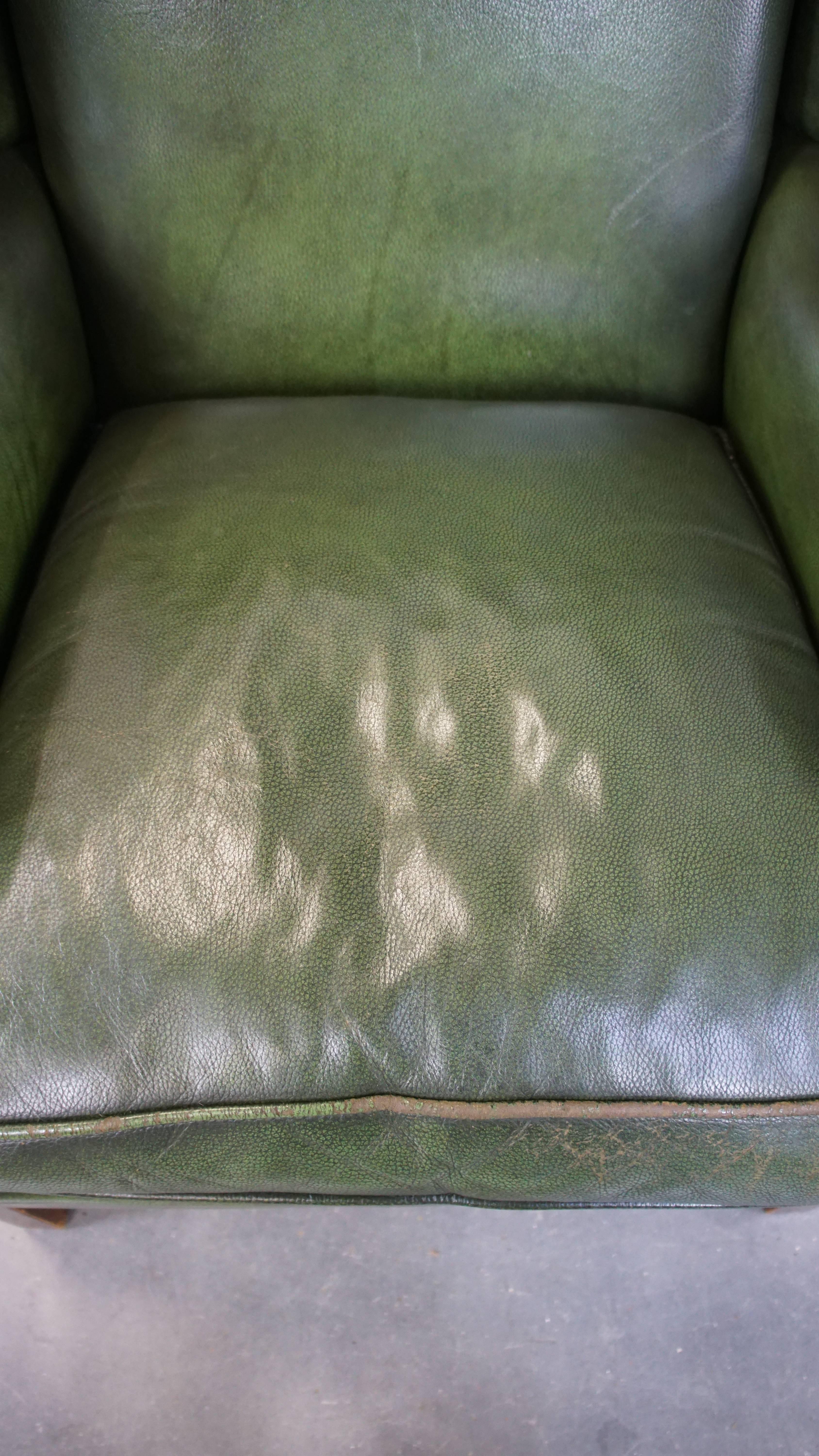 Cowhide Classic green cowhide English Chesterfield wing chair with a comfortable seat For Sale