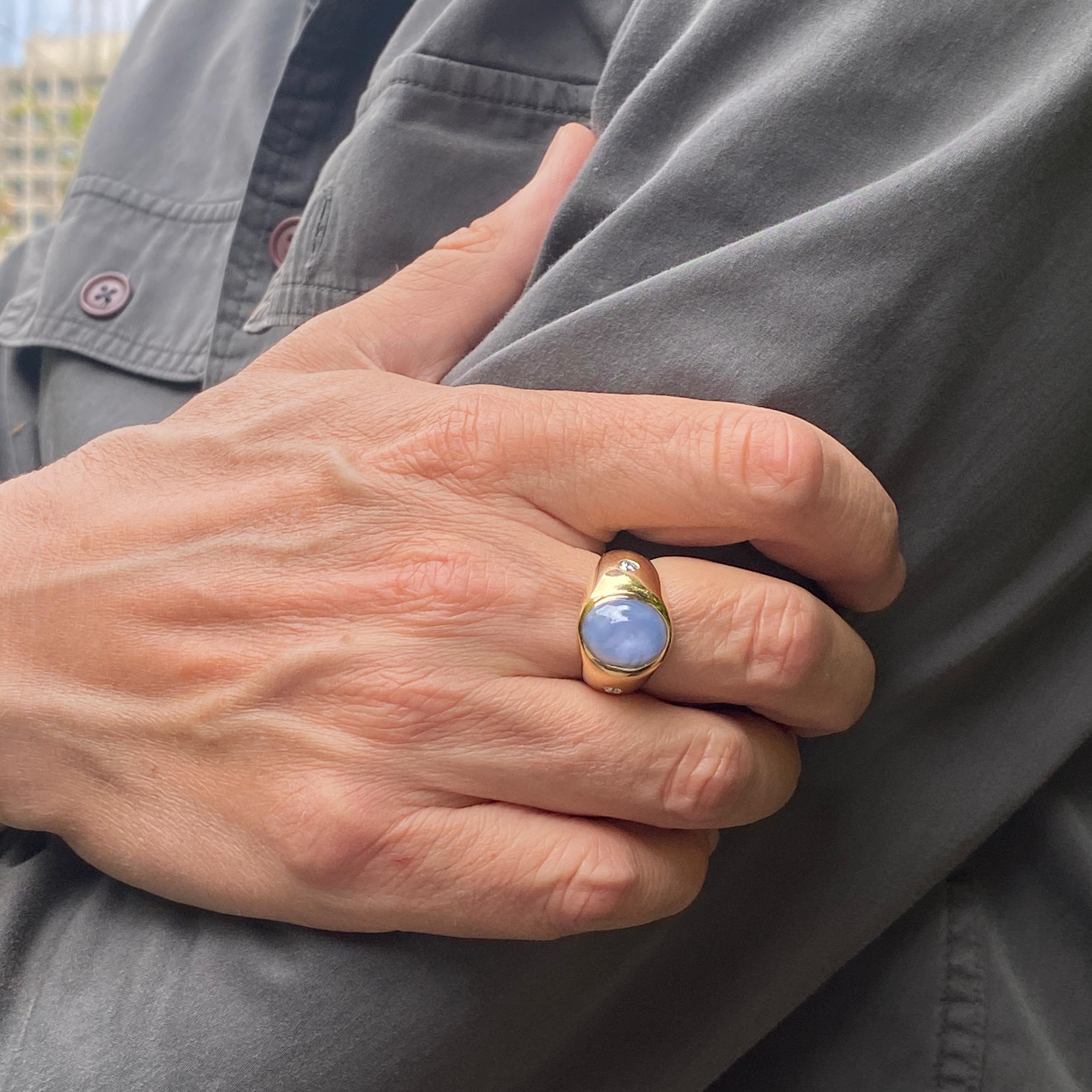 This amazing ring, made here in our shop by Eytan Brandes, features a large natural and untreated high-dome oval star sapphire cabochon.  The stone was the centerpiece of a 1950s diamond starburst cocktail ring, but Eytan wanted to make a modern