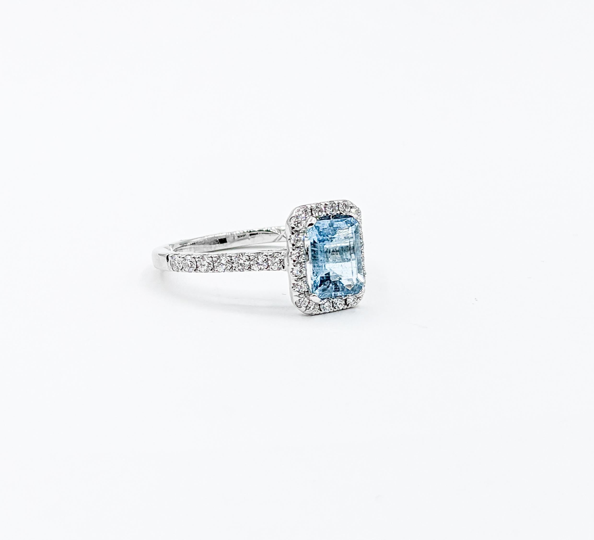 Classic Halo Aquamarine & Diamond Engagement Ring in 14K White Gold

Presenting this stunning aquamarine ring, intricately fashioned from 14k white gold with shimmering diamond details. This ring highlights a bright 1.08ct Aquamarine centerpiece in