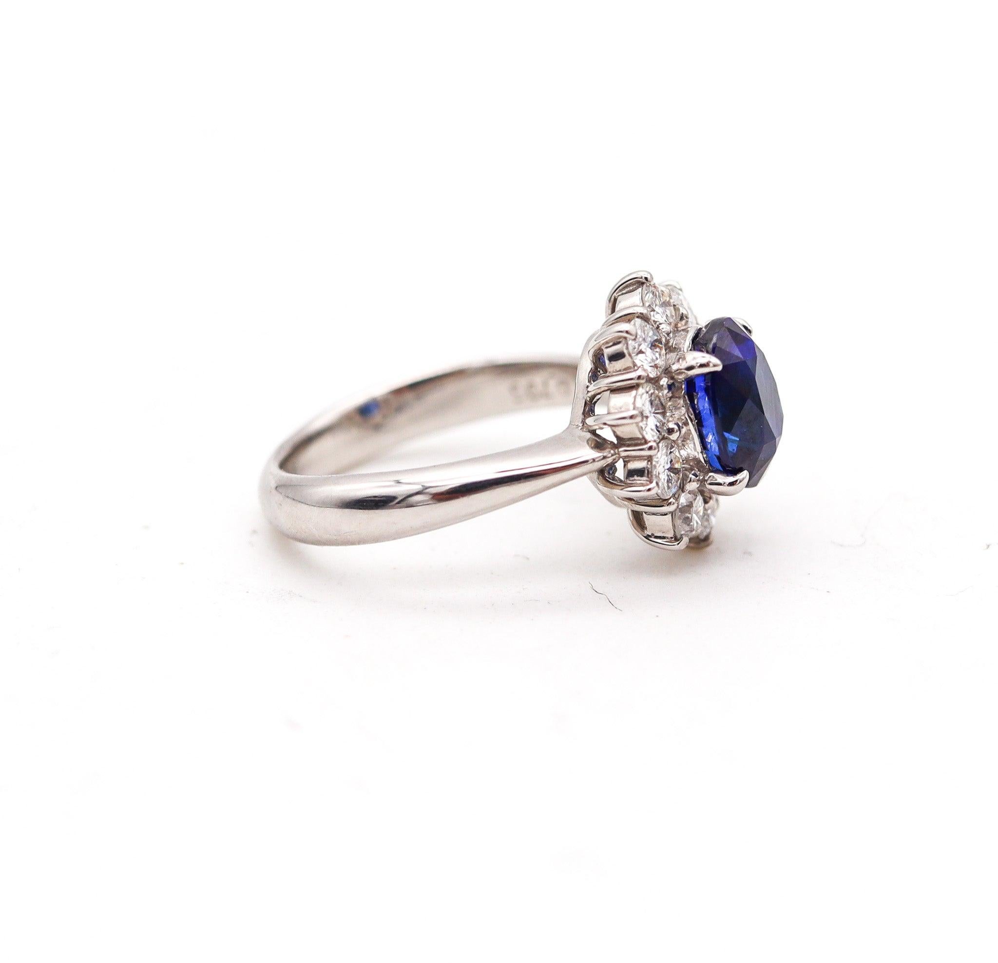 CLASSIC Halo Ring In Platinum With 3.14 Ctw In Sapphires And Diamonds In Excellent Condition For Sale In Miami, FL