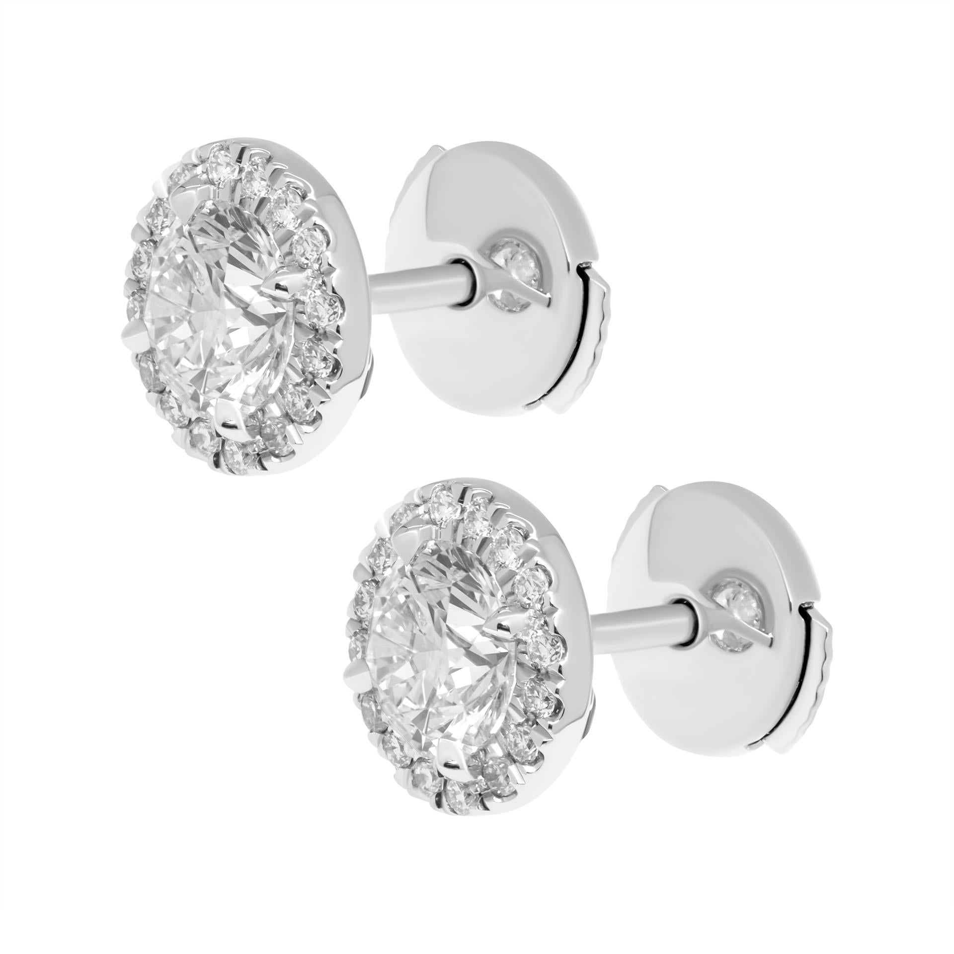 Classic halo ROUND studs in Platinum 
Total Carat Weight: 1.40ct (0.70ct each rounds diamond) (5.60mm each)
