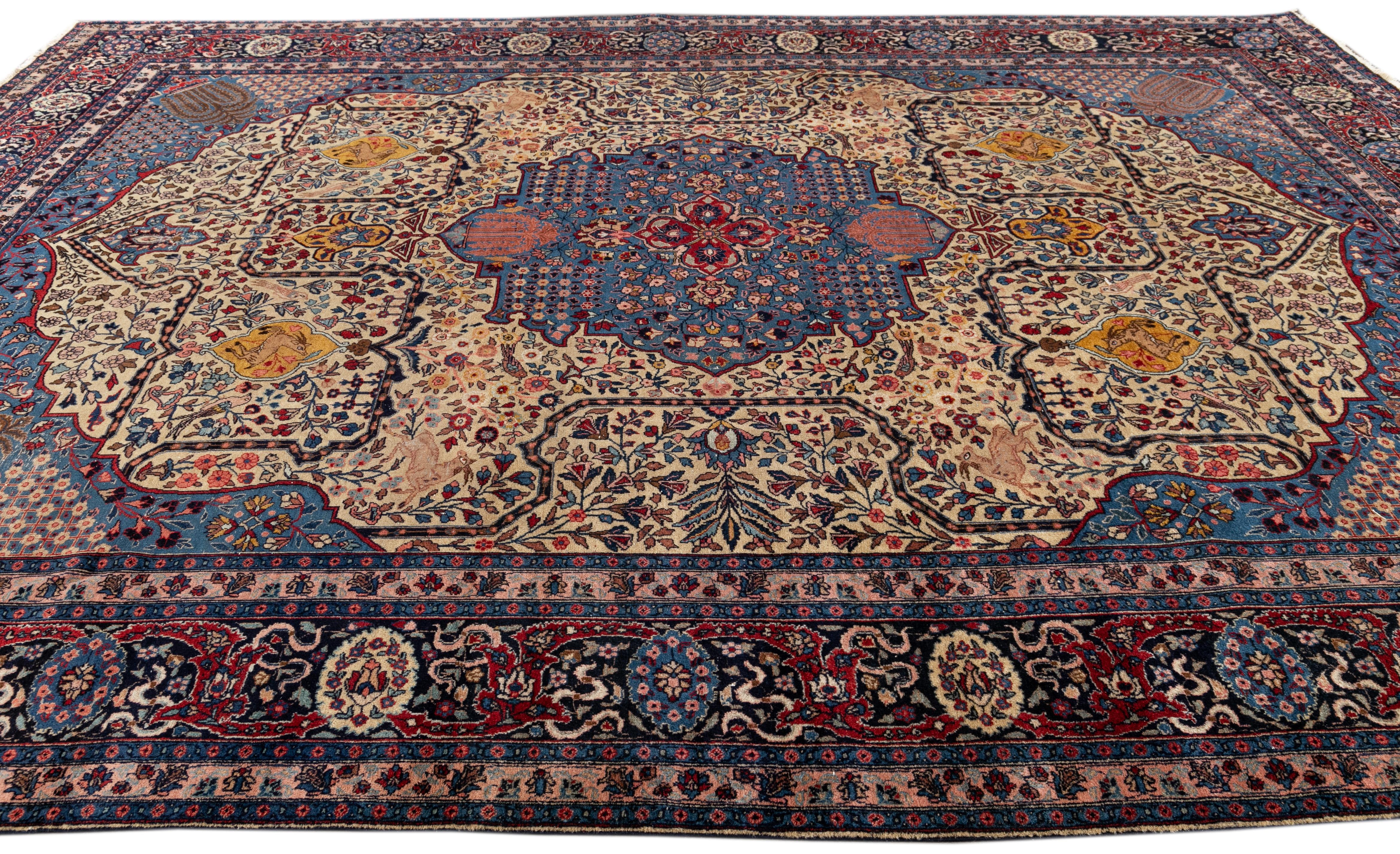 Beautiful Persian Isfahan hand-knotted natural wool rug with a tan color field. This piece has a designed frame with multicolor accents in an all-over medallion floral design.

This rug measures: 11'7