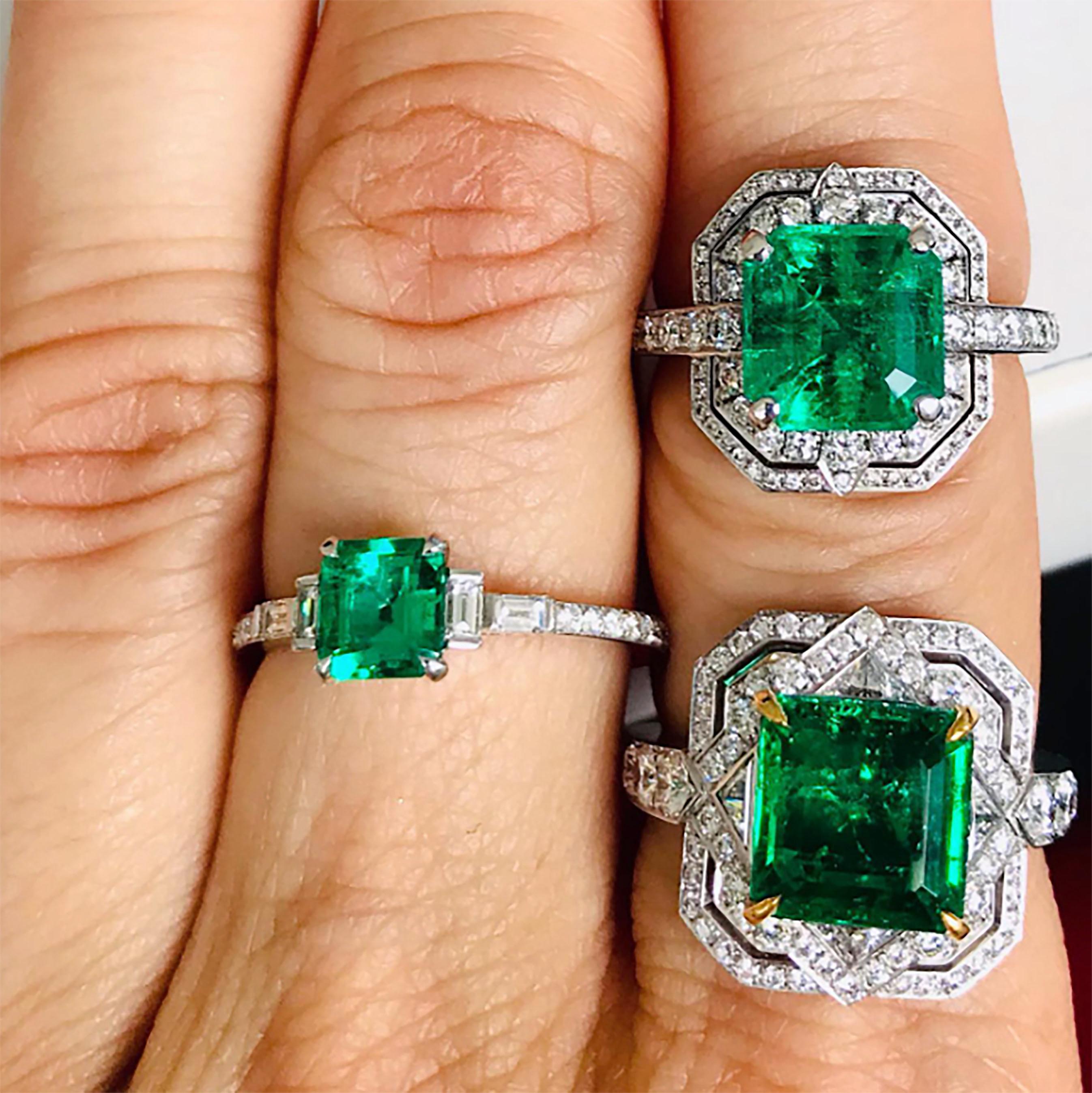 Glistening platinum ring with a deep green emerald set with talon-shaped claws, two baguette diamonds at each side set with half bezels, follow by round diamonds that complete a half eternity band. 

Ring Size: UK - M, US - 6 1/4
0.68 Carat Emerald